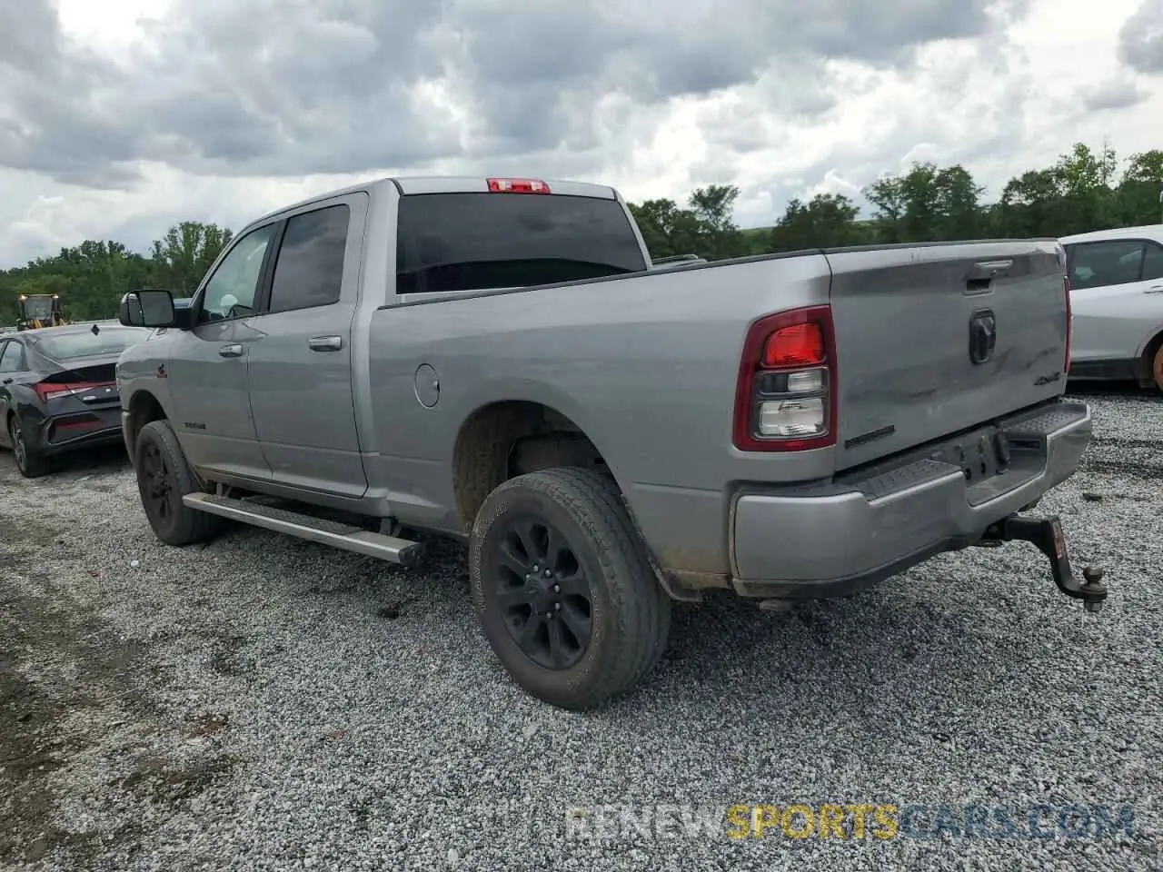 2 Photograph of a damaged car 3C6UR5DL3MG658395 RAM 2500 2021