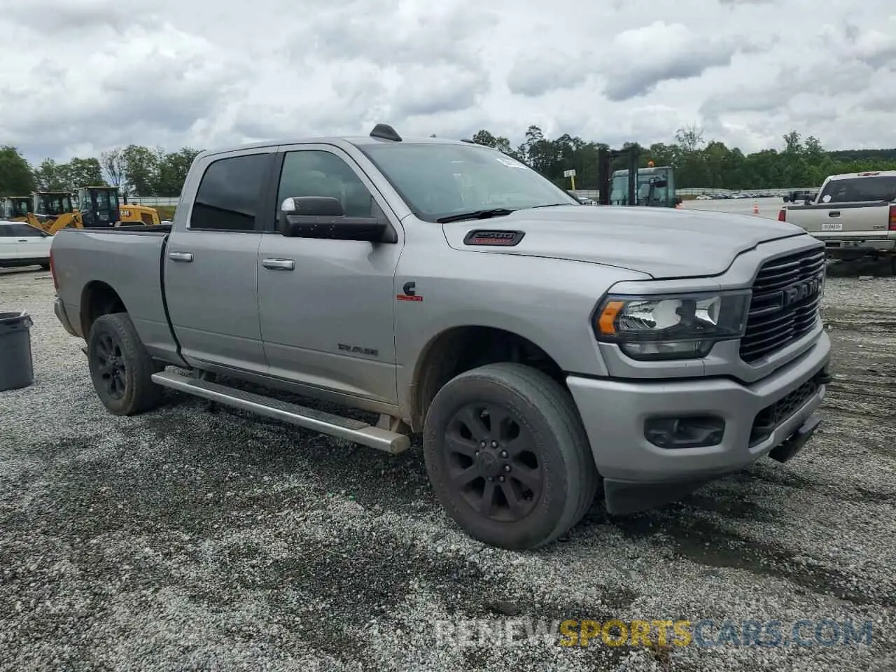 4 Photograph of a damaged car 3C6UR5DL3MG658395 RAM 2500 2021