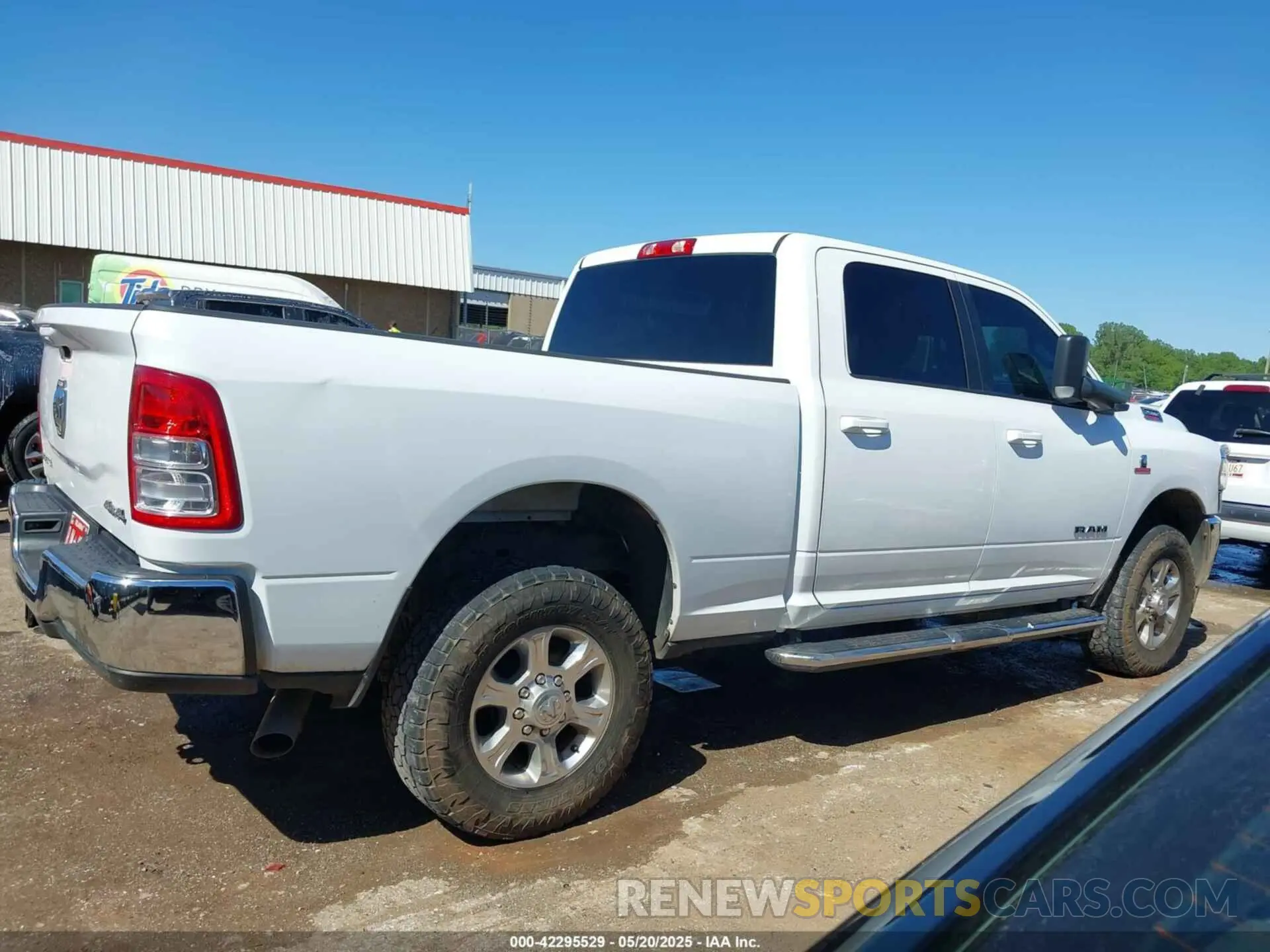 13 Photograph of a damaged car 3C6UR5DL6MG512539 RAM 2500 2021