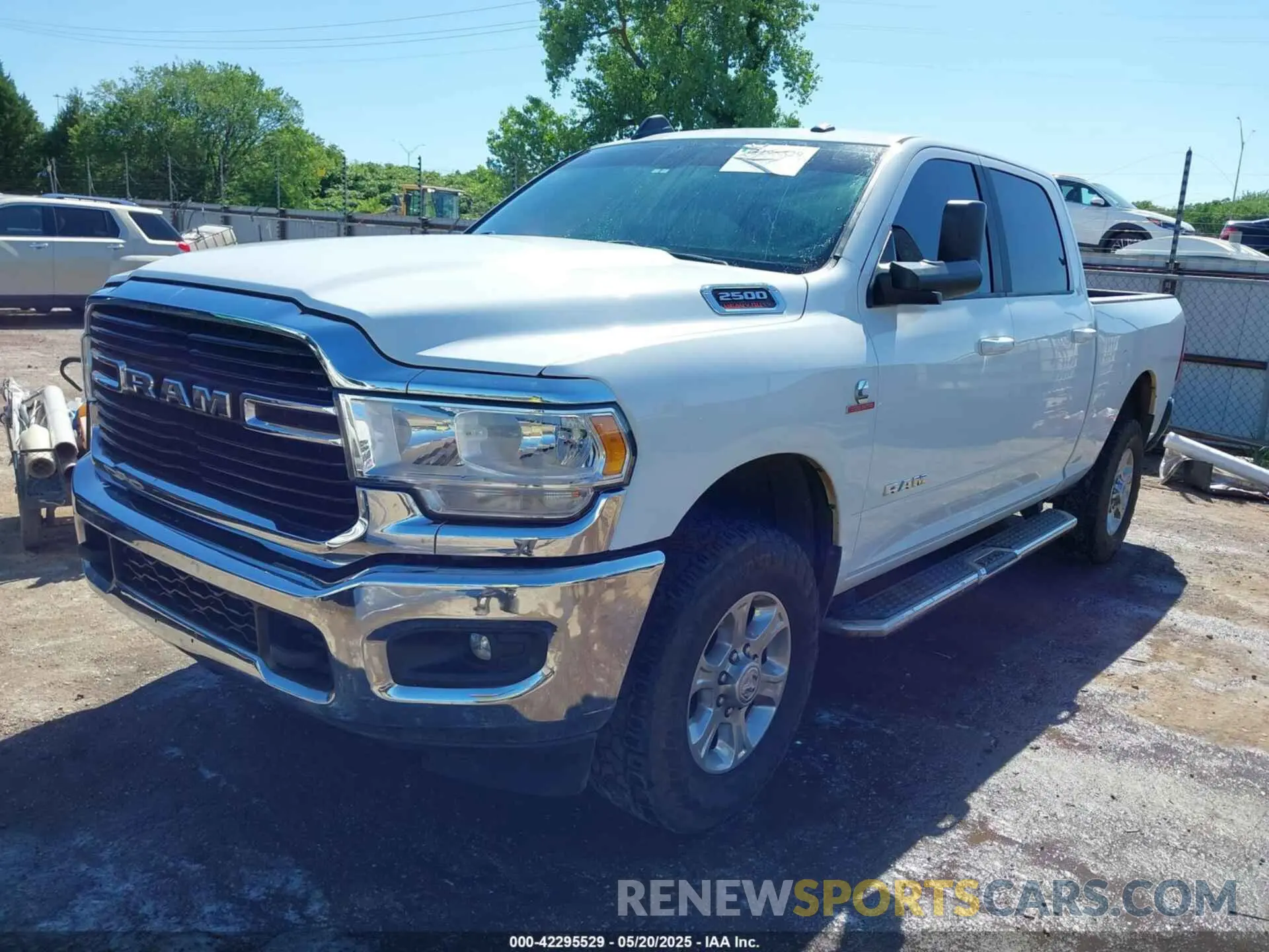 2 Photograph of a damaged car 3C6UR5DL6MG512539 RAM 2500 2021