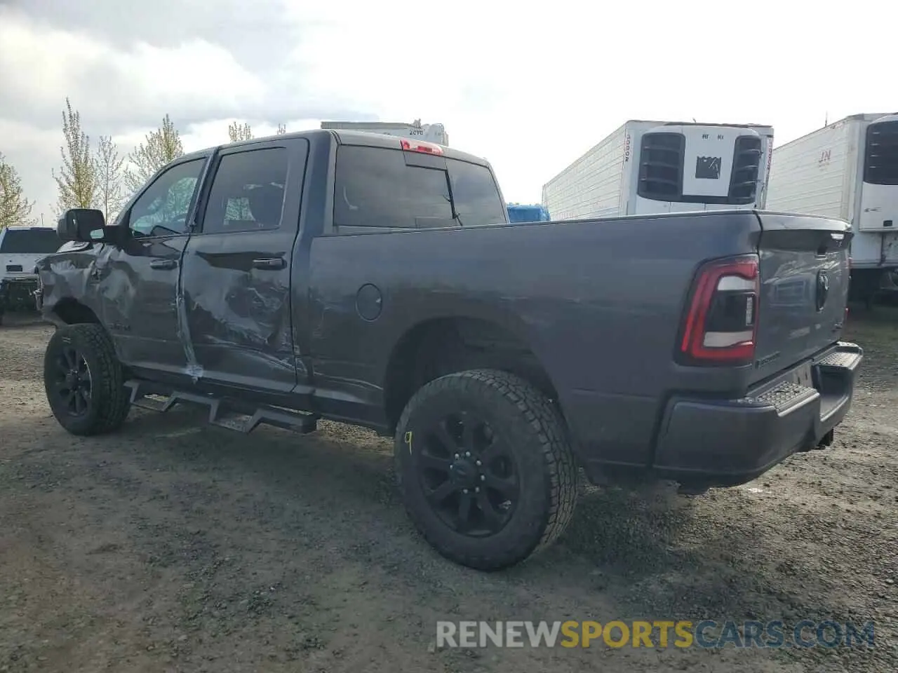 2 Photograph of a damaged car 3C6UR5DL7MG561281 RAM 2500 2021