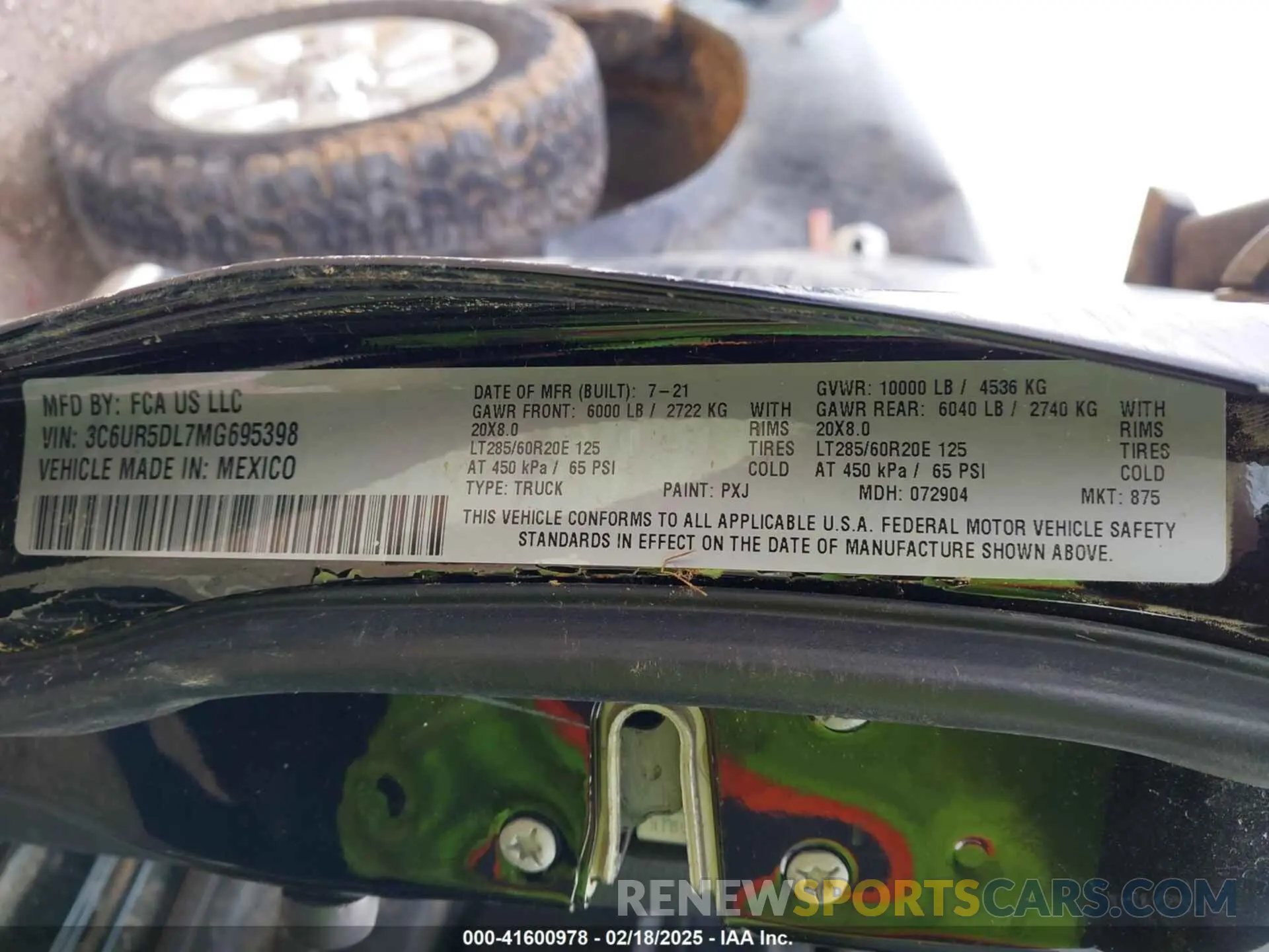 9 Photograph of a damaged car 3C6UR5DL7MG695398 RAM 2500 2021
