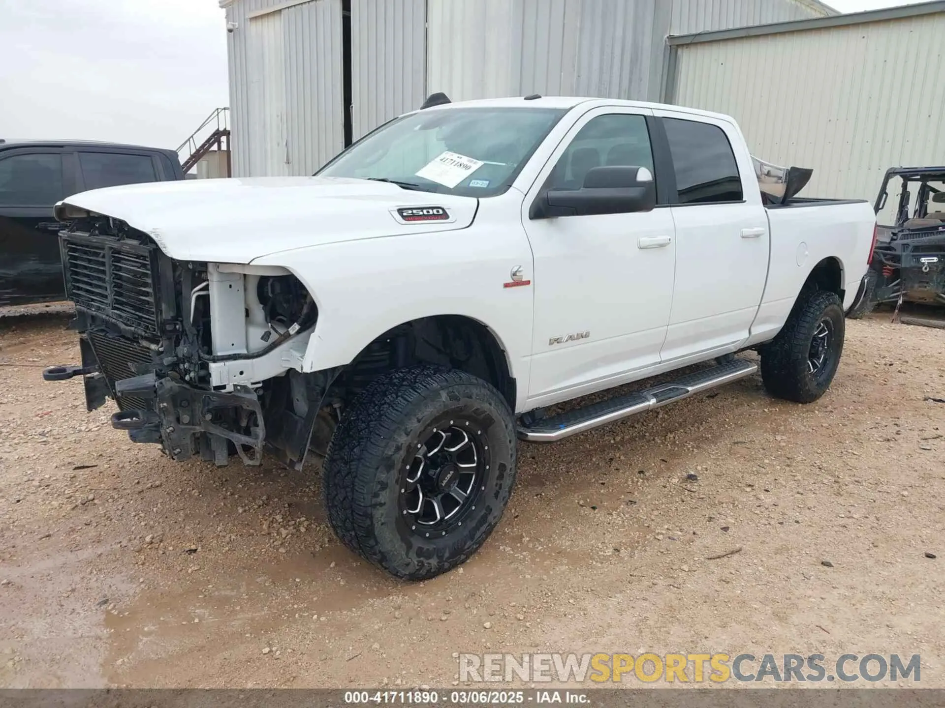 2 Photograph of a damaged car 3C6UR5DL8MG605823 RAM 2500 2021