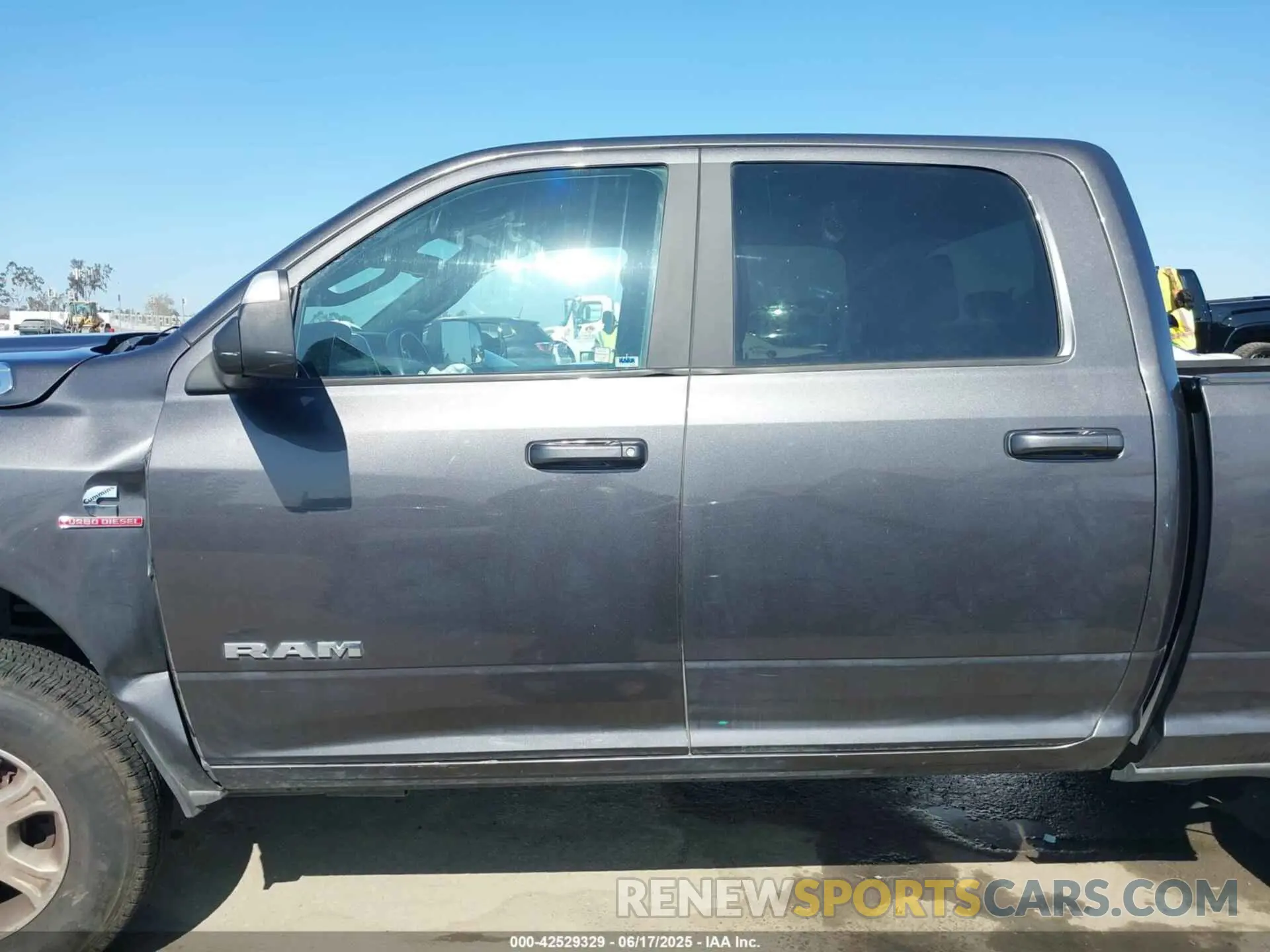13 Photograph of a damaged car 3C6UR5DLXMG584554 RAM 2500 2021