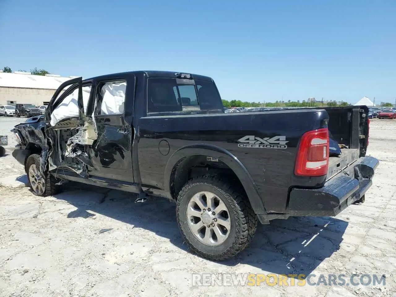 2 Photograph of a damaged car 3C6UR5FL2MG611033 RAM 2500 2021
