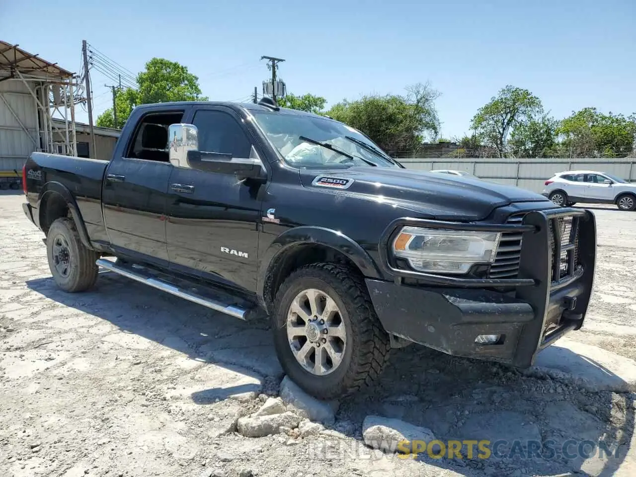 4 Photograph of a damaged car 3C6UR5FL2MG611033 RAM 2500 2021