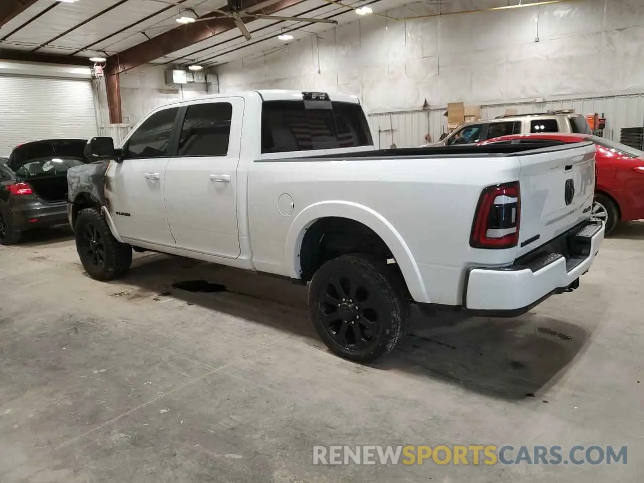 2 Photograph of a damaged car 3C6UR5FL3MG502502 RAM 2500 2021