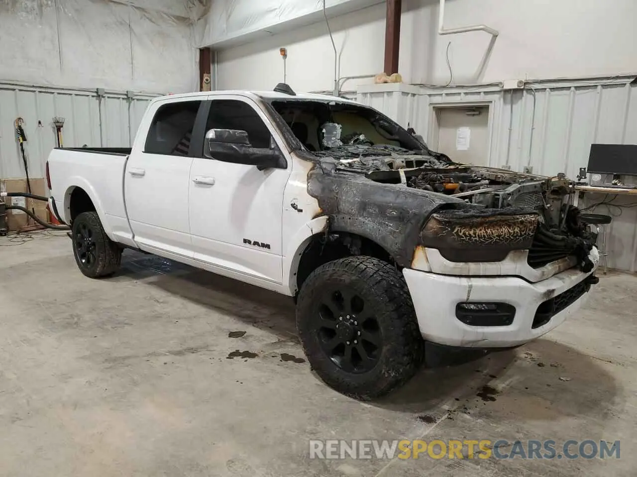 4 Photograph of a damaged car 3C6UR5FL3MG502502 RAM 2500 2021