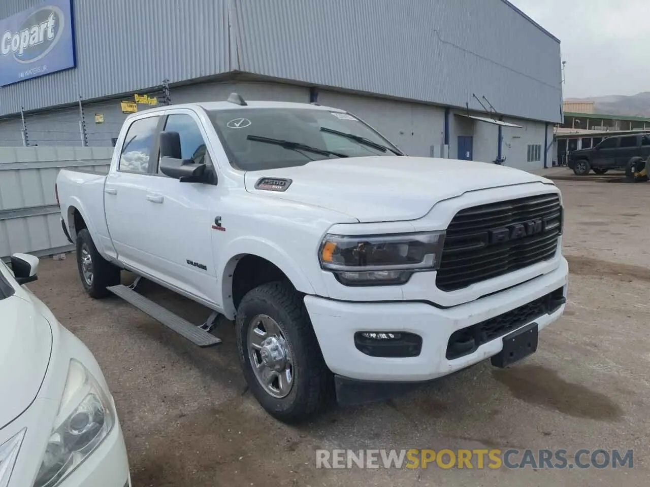 4 Photograph of a damaged car 3C6UR5FL4MG612250 RAM 2500 2021