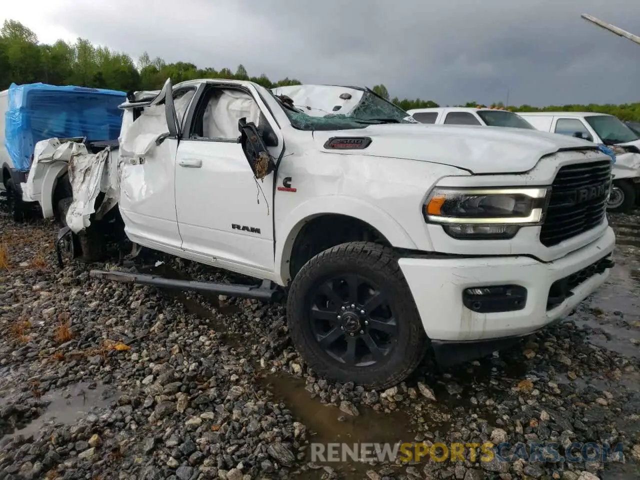 4 Photograph of a damaged car 3C6UR5FL8MG534877 RAM 2500 2021