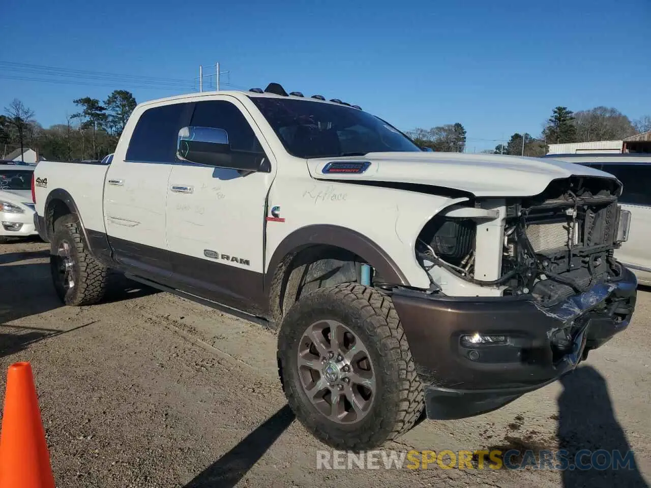 4 Photograph of a damaged car 3C6UR5GL6MG520314 RAM 2500 2021