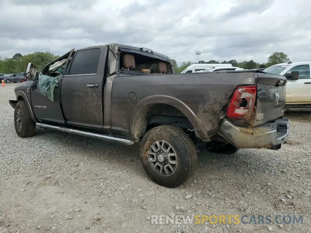 2 Photograph of a damaged car 3C6UR5GL6MG624236 RAM 2500 2021