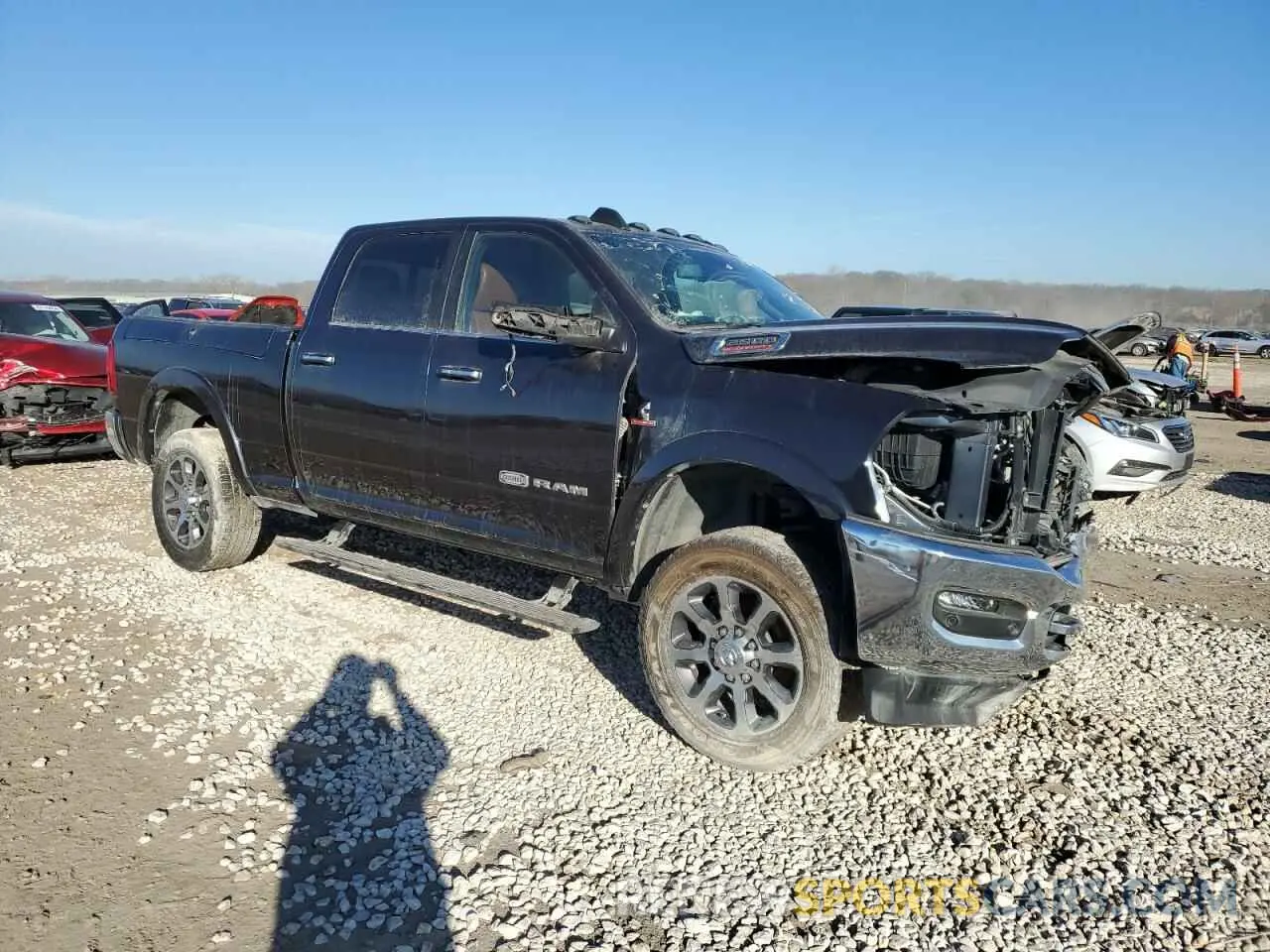 4 Photograph of a damaged car 3C6UR5GL8MG582023 RAM 2500 2021