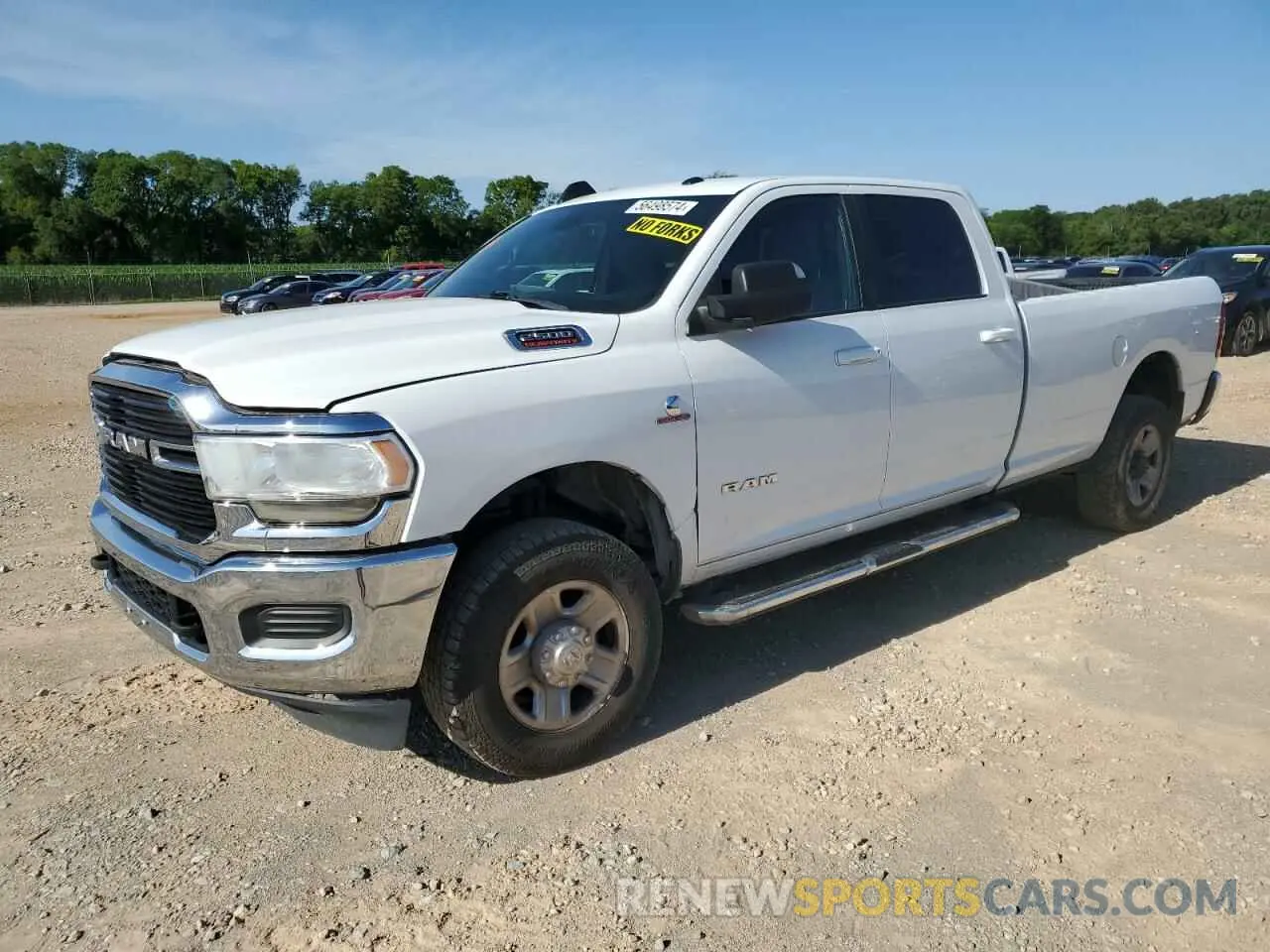 1 Photograph of a damaged car 3C6UR5JL0MG542107 RAM 2500 2021