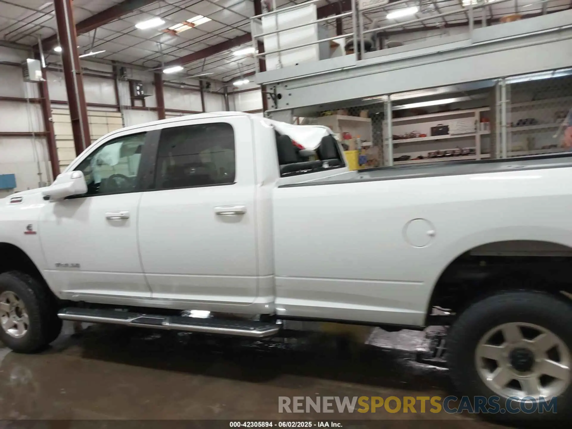 14 Photograph of a damaged car 3C6UR5JL5MG554642 RAM 2500 2021