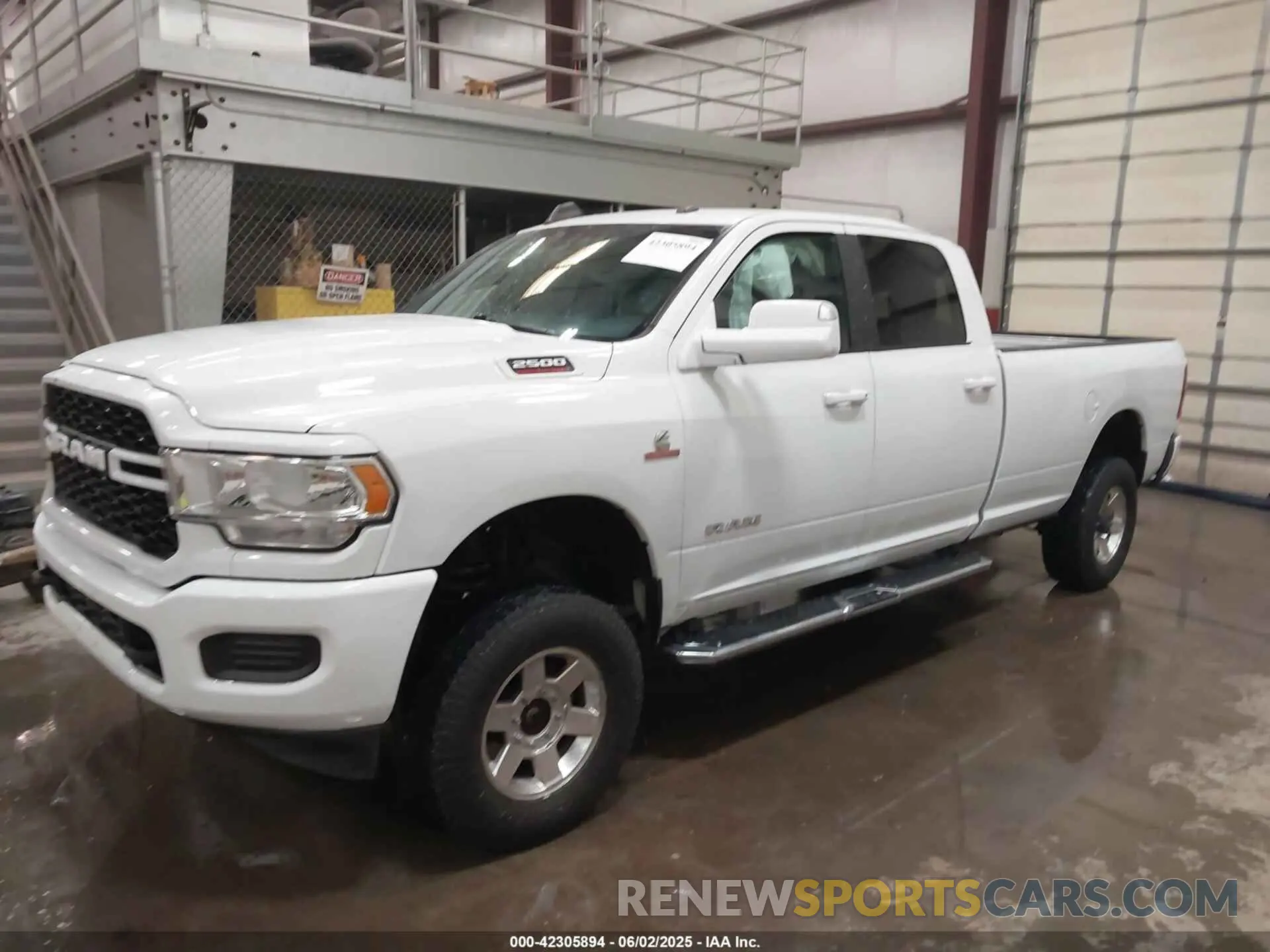 2 Photograph of a damaged car 3C6UR5JL5MG554642 RAM 2500 2021