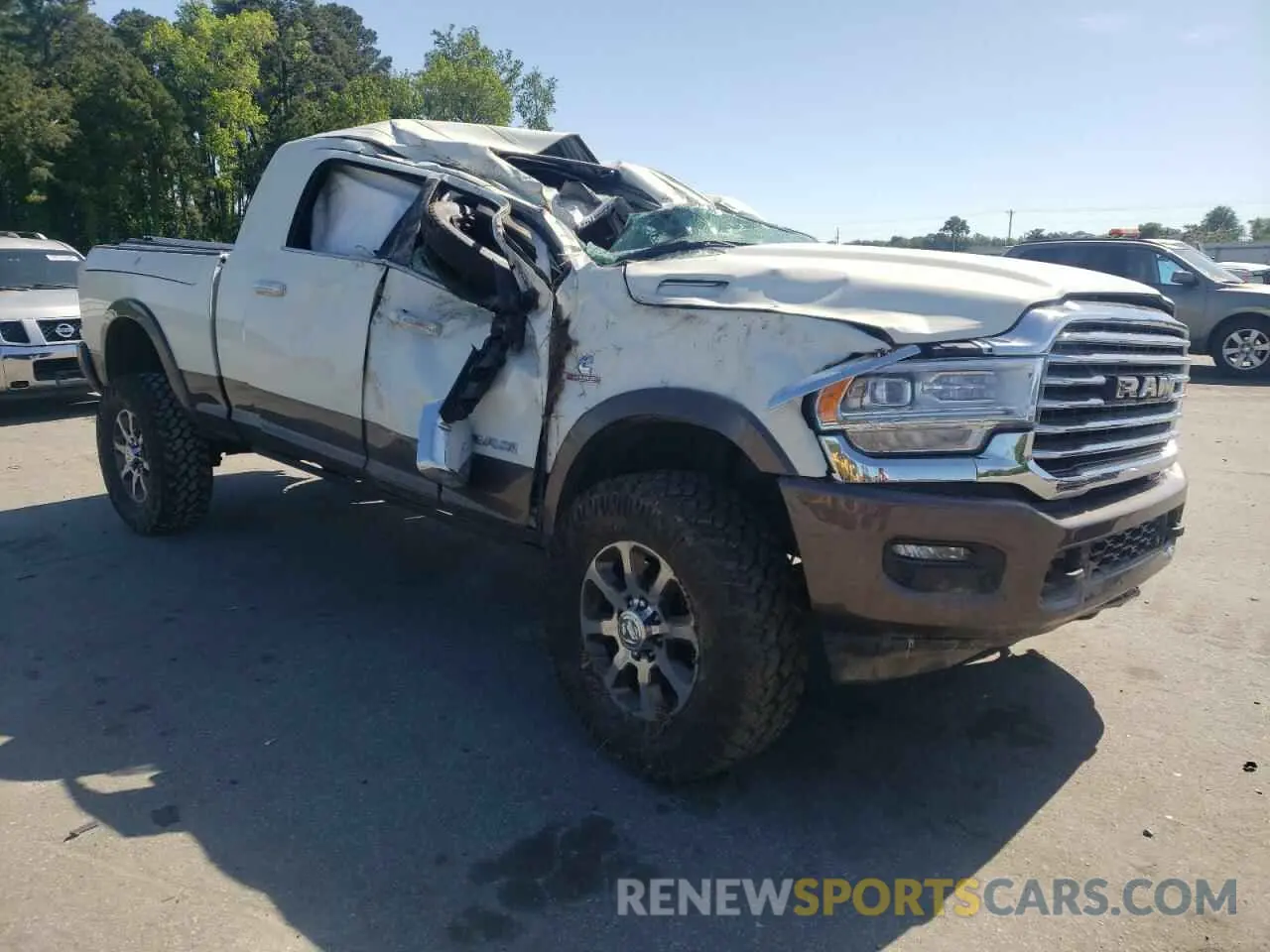 4 Photograph of a damaged car 3C6UR5PL3MG597335 RAM 2500 2021