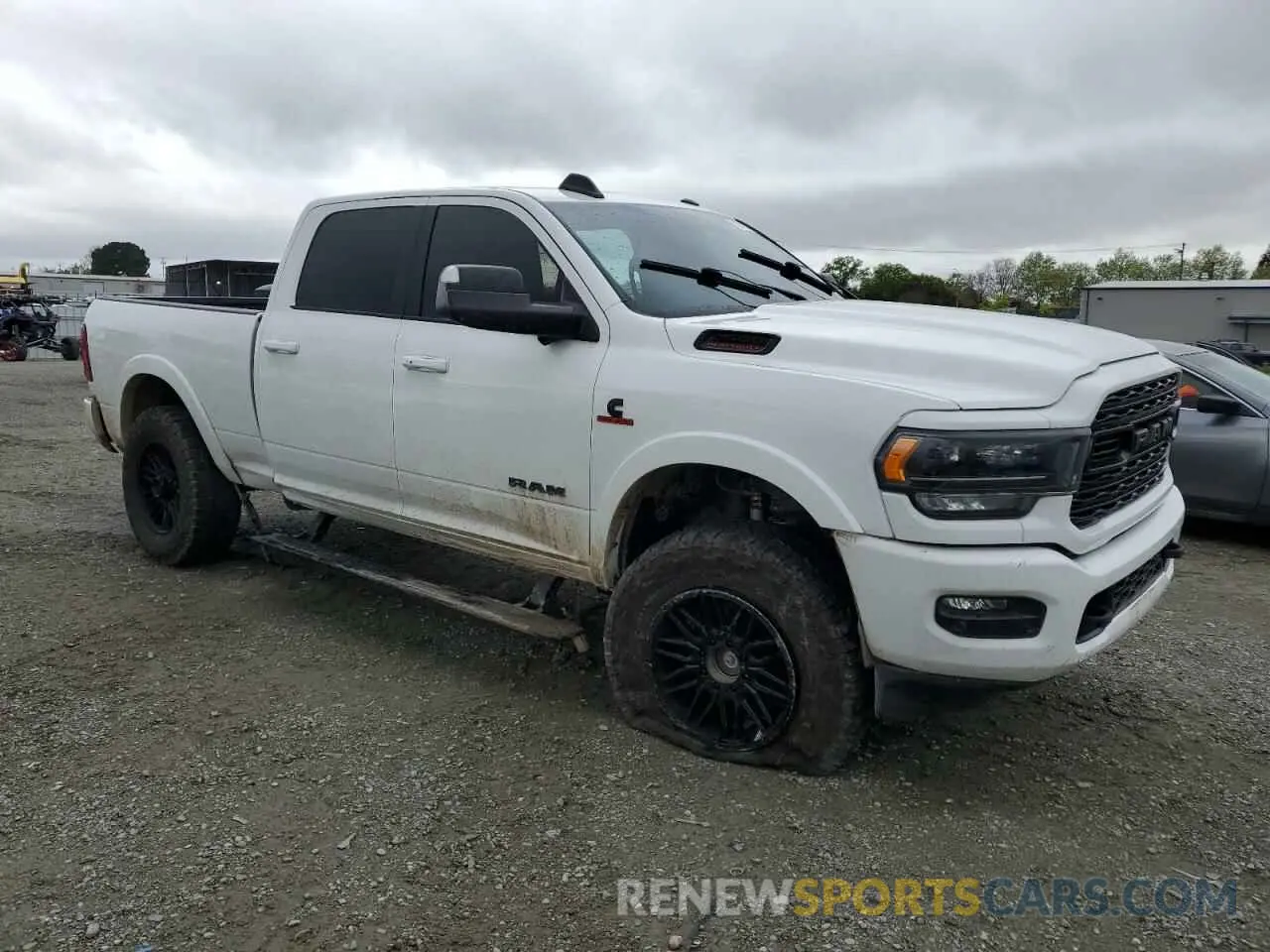 4 Photograph of a damaged car 3C6UR5SL5MG653685 RAM 2500 2021