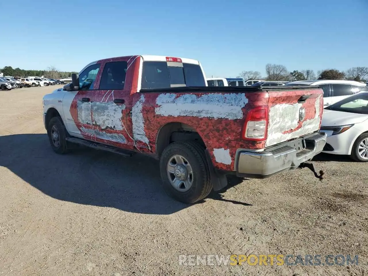 2 Photograph of a damaged car 3C6UR5CJ1NG129156 RAM 2500 2022