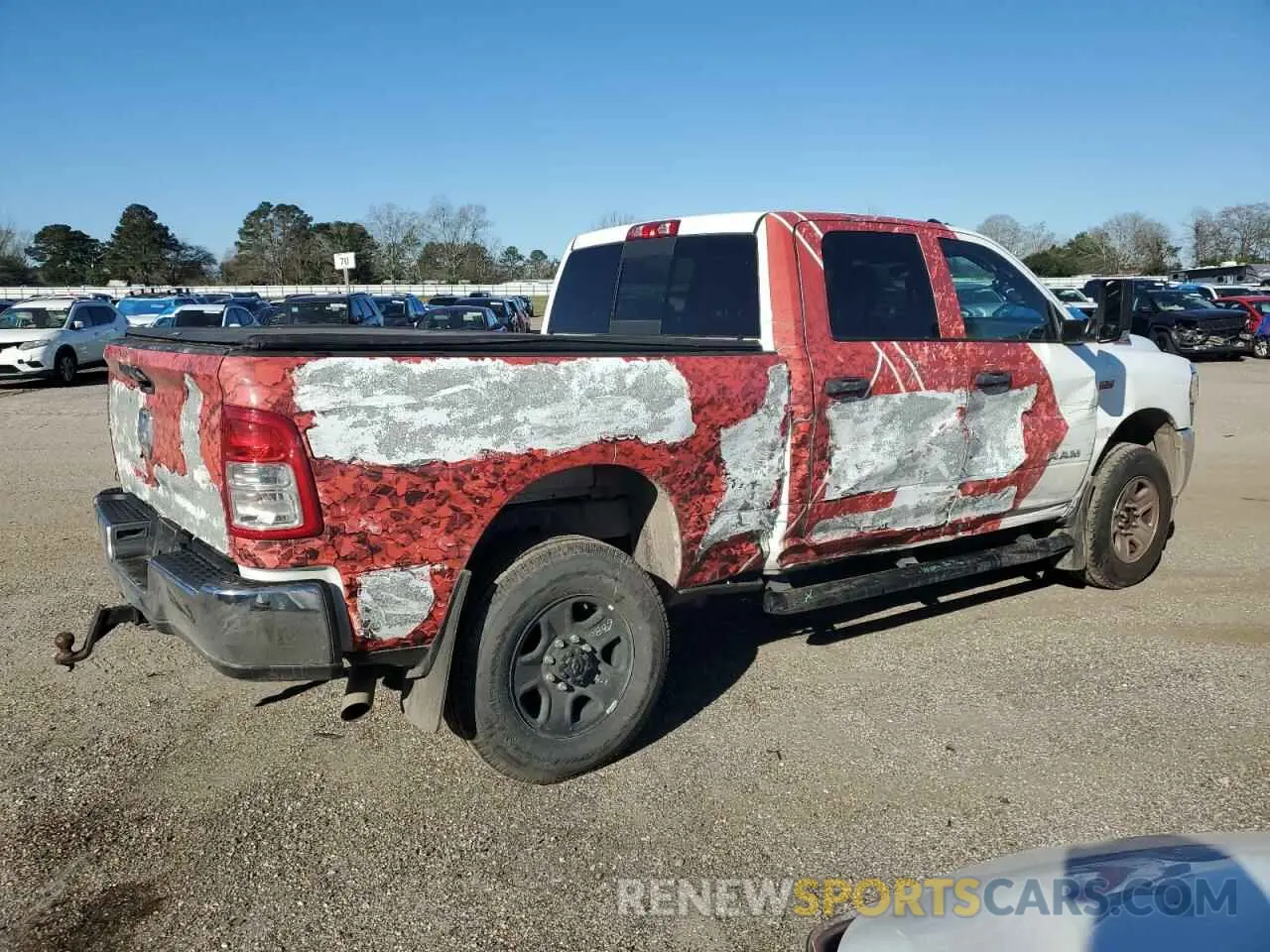 3 Photograph of a damaged car 3C6UR5CJ1NG129156 RAM 2500 2022