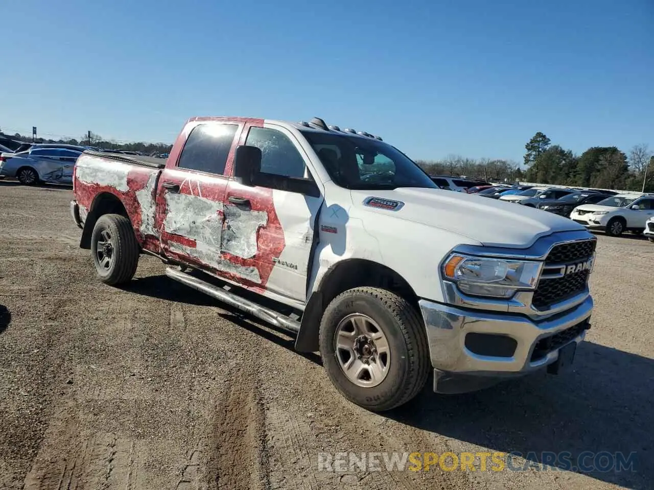4 Photograph of a damaged car 3C6UR5CJ1NG129156 RAM 2500 2022