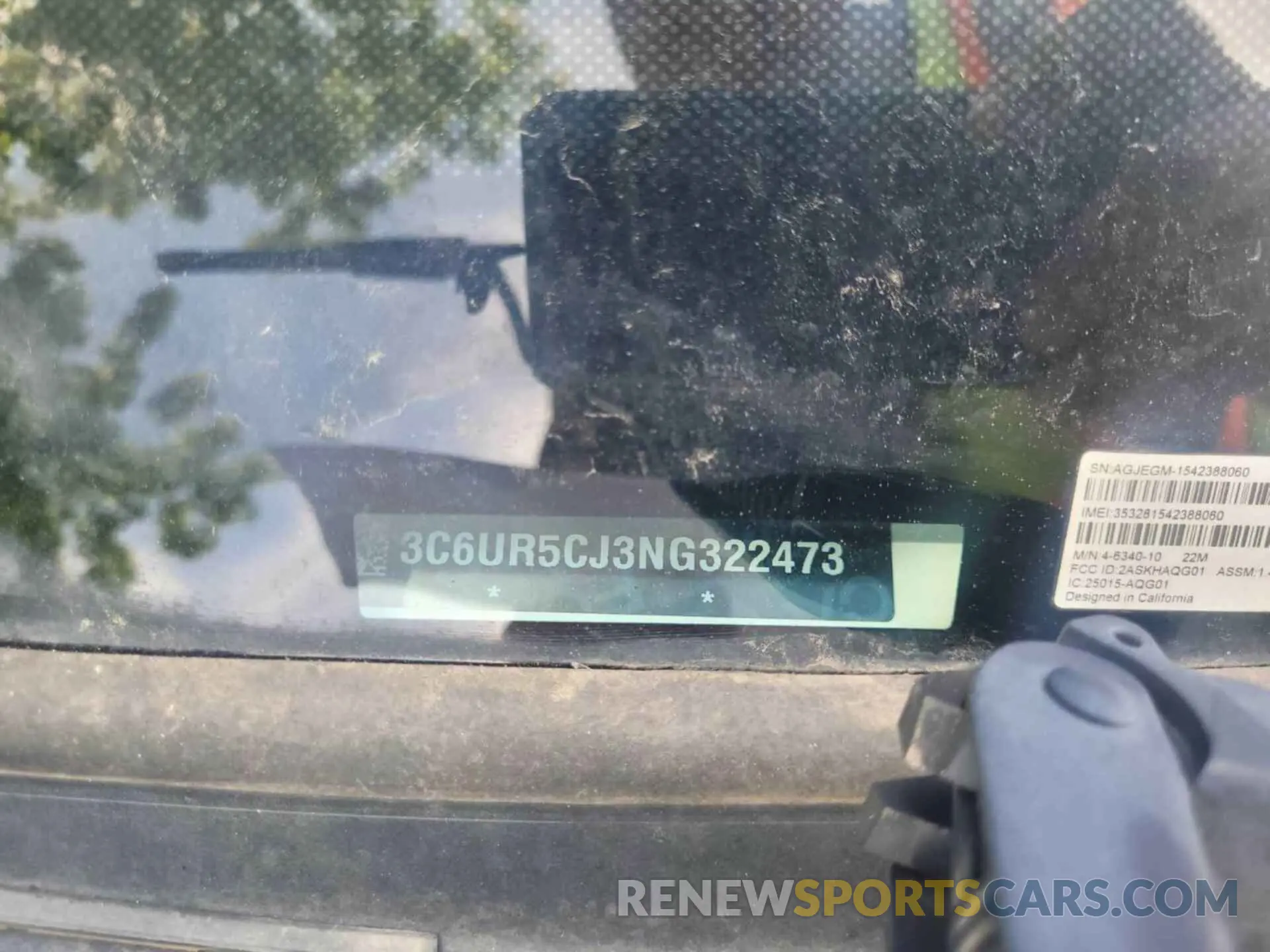 4 Photograph of a damaged car 3C6UR5CJ3NG322473 RAM 2500 2022