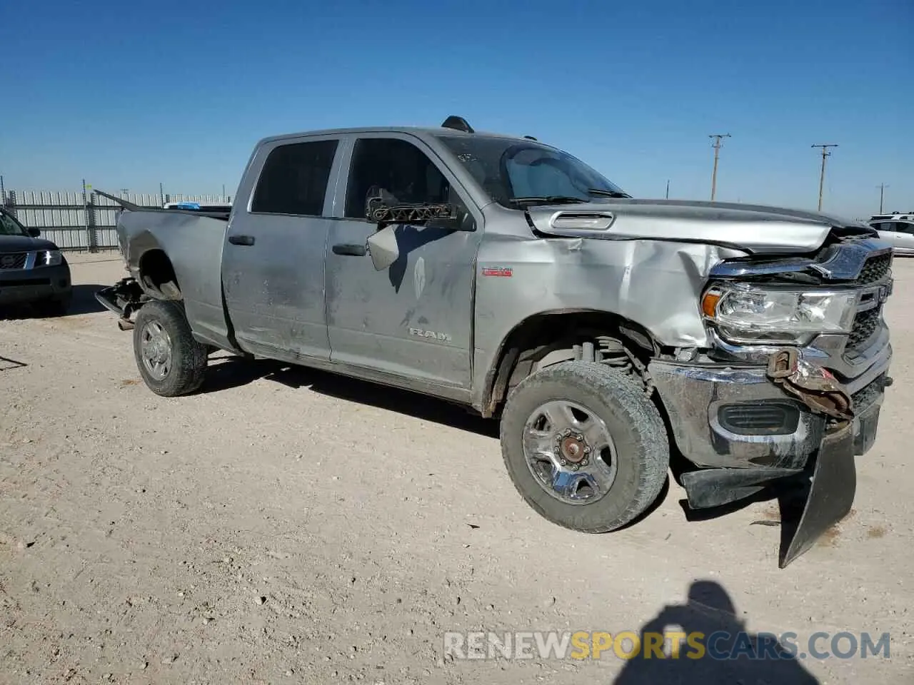 4 Photograph of a damaged car 3C6UR5CJ4NG325723 RAM 2500 2022