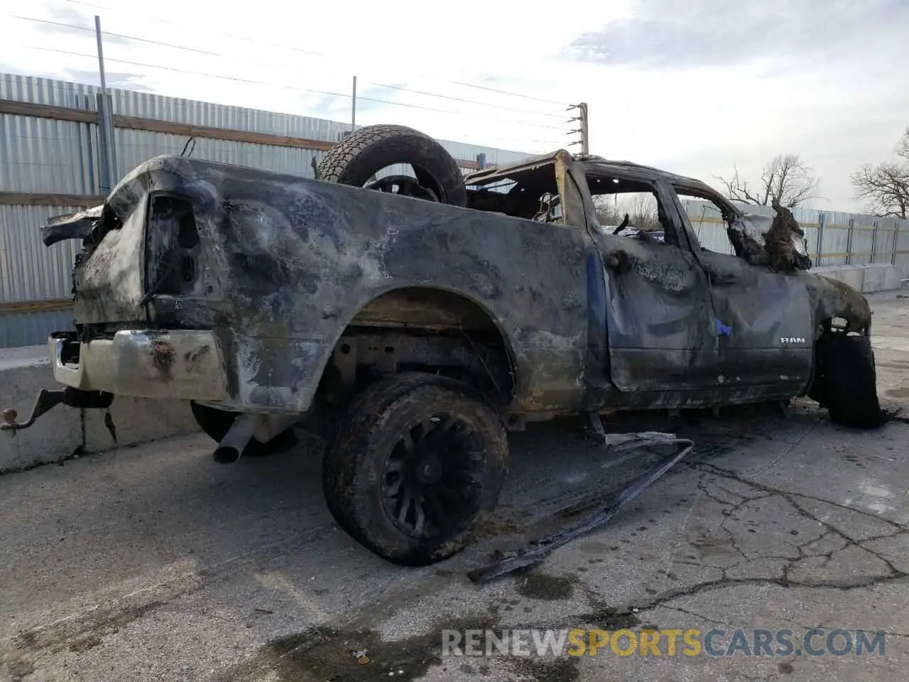 3 Photograph of a damaged car 3C6UR5CJ5NG366667 RAM 2500 2022