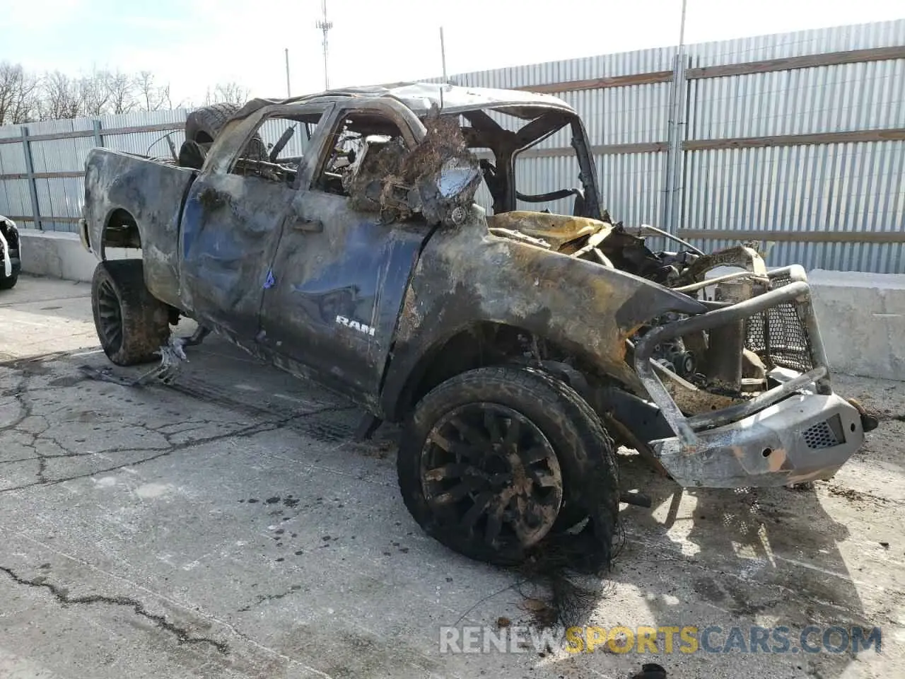 4 Photograph of a damaged car 3C6UR5CJ5NG366667 RAM 2500 2022