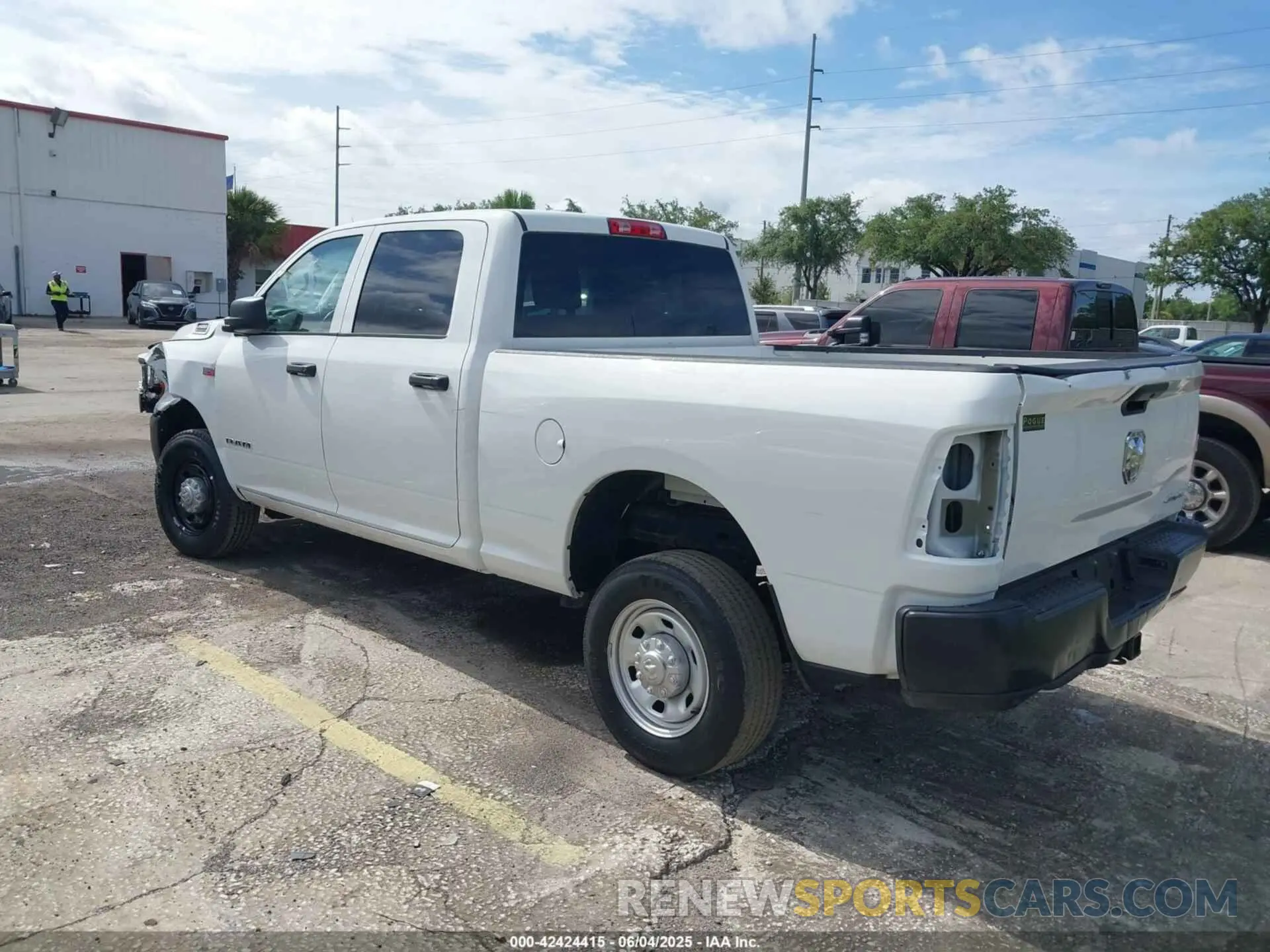 3 Photograph of a damaged car 3C6UR5CJ9NG202399 RAM 2500 2022