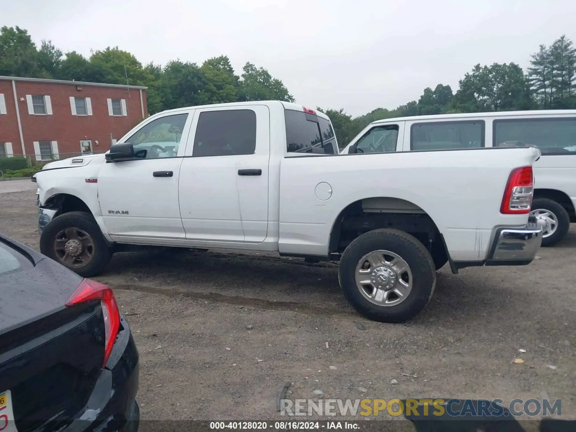 14 Photograph of a damaged car 3C6UR5CJXNG110864 RAM 2500 2022