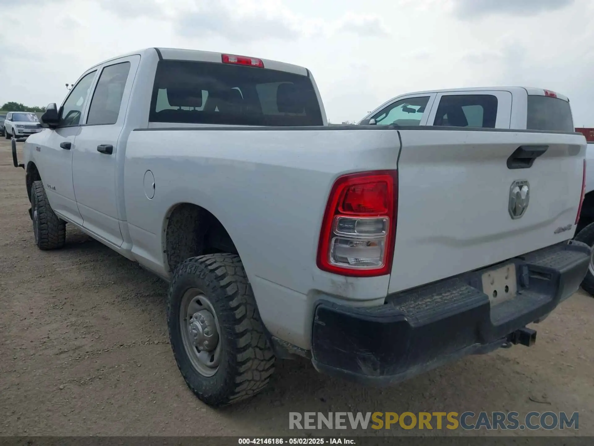 3 Photograph of a damaged car 3C6UR5CJXNG204016 RAM 2500 2022