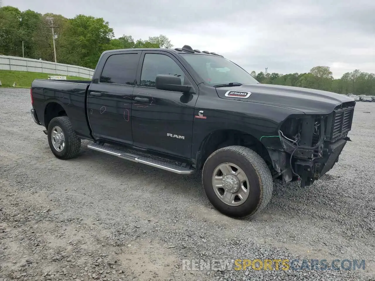 4 Photograph of a damaged car 3C6UR5CL0NG221389 RAM 2500 2022