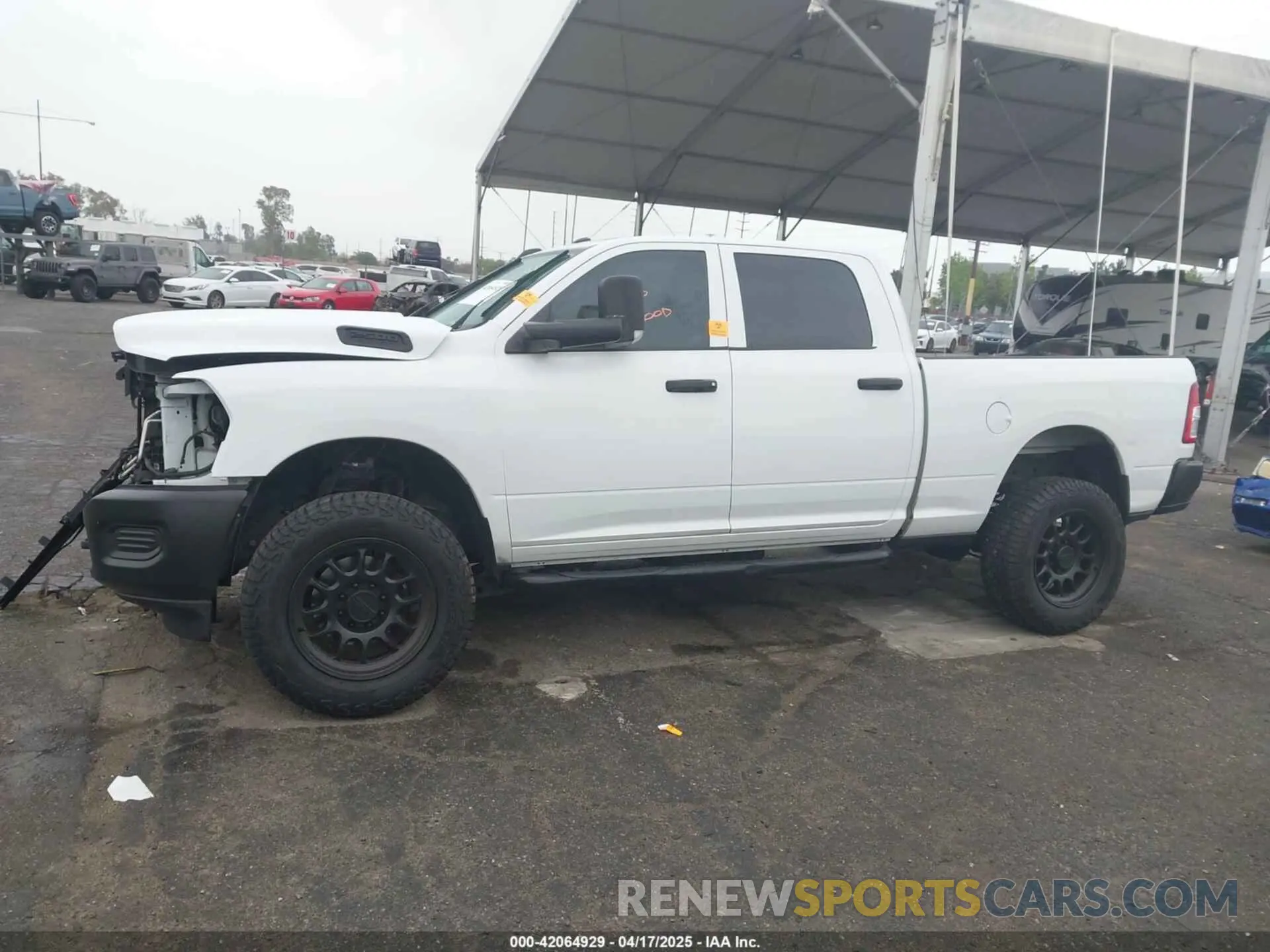 14 Photograph of a damaged car 3C6UR5CL1NG438188 RAM 2500 2022