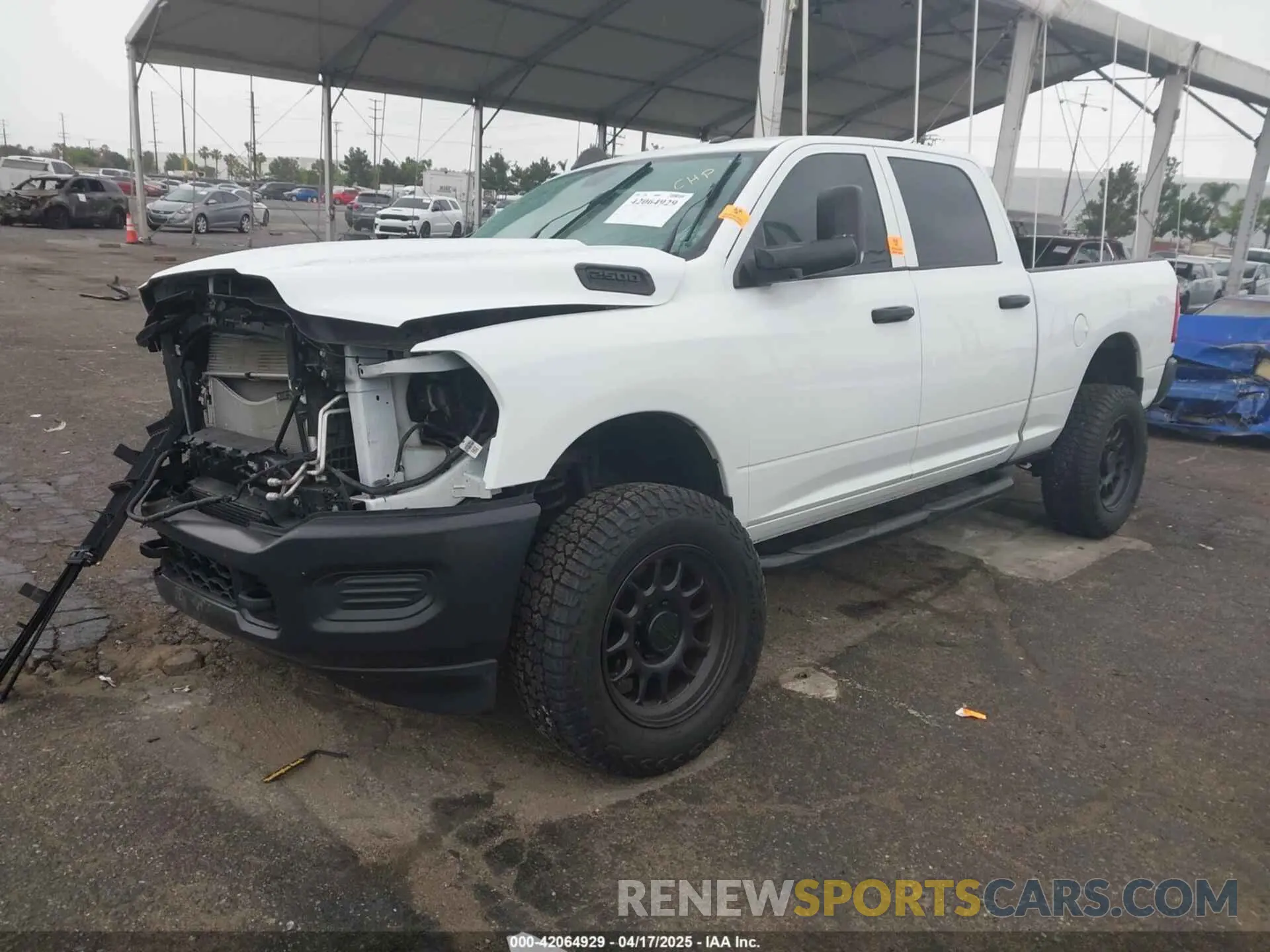2 Photograph of a damaged car 3C6UR5CL1NG438188 RAM 2500 2022