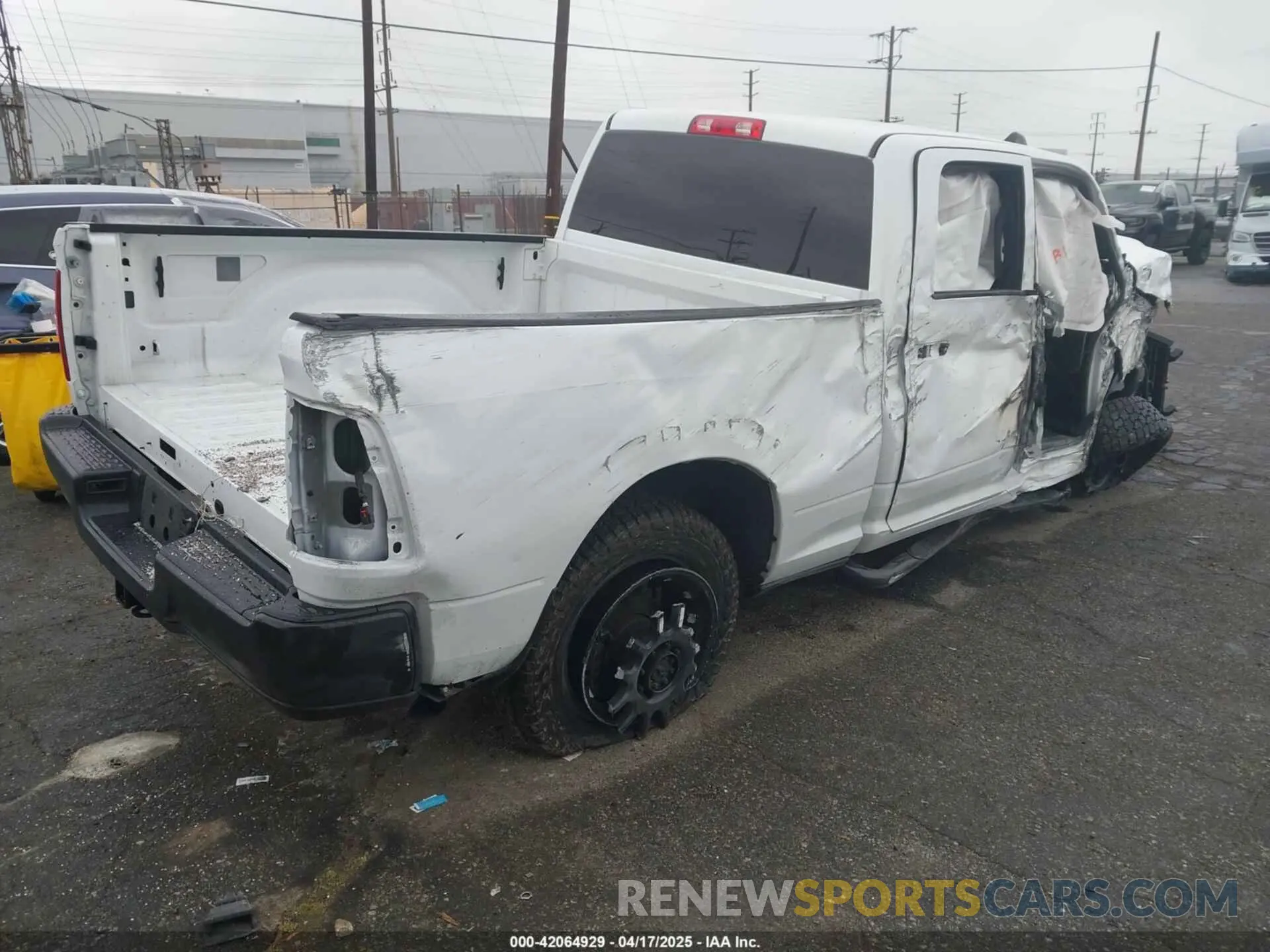 4 Photograph of a damaged car 3C6UR5CL1NG438188 RAM 2500 2022
