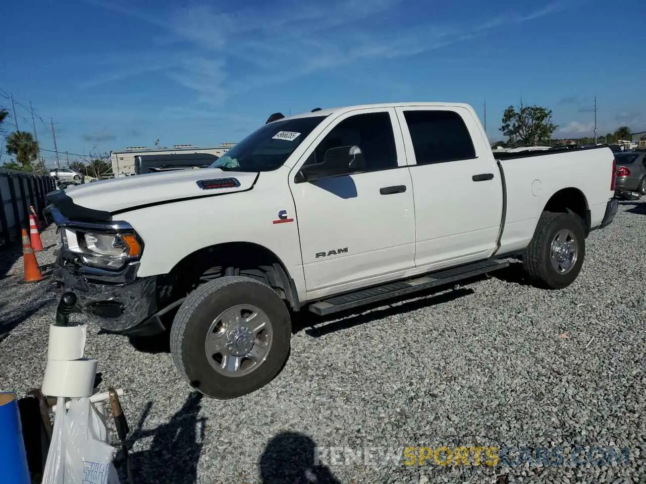 1 Photograph of a damaged car 3C6UR5CL3NG176111 RAM 2500 2022