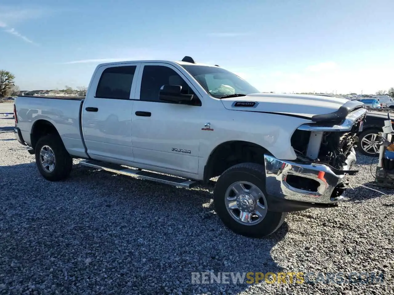 4 Photograph of a damaged car 3C6UR5CL3NG176111 RAM 2500 2022
