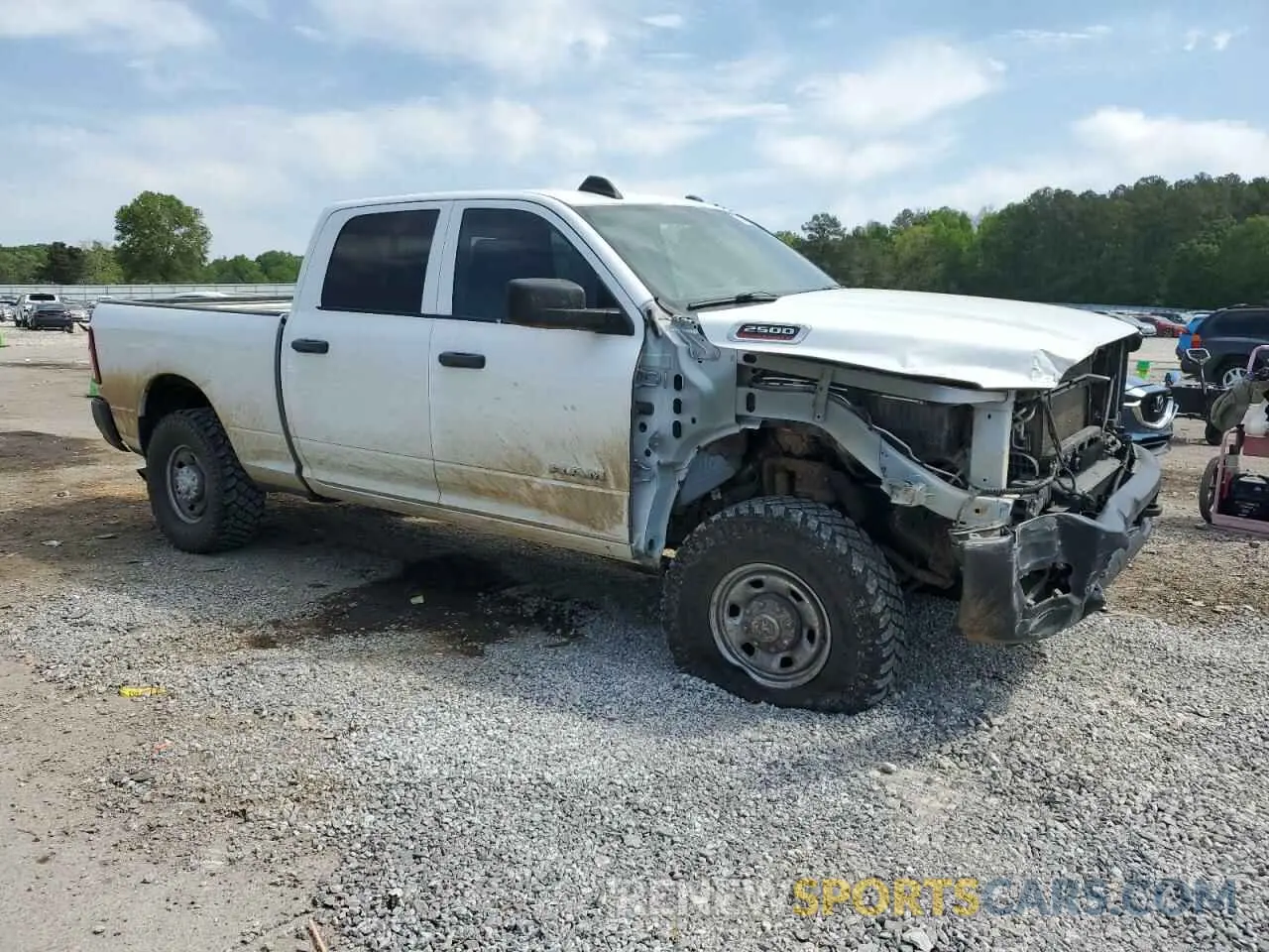 4 Photograph of a damaged car 3C6UR5CL5NG139495 RAM 2500 2022