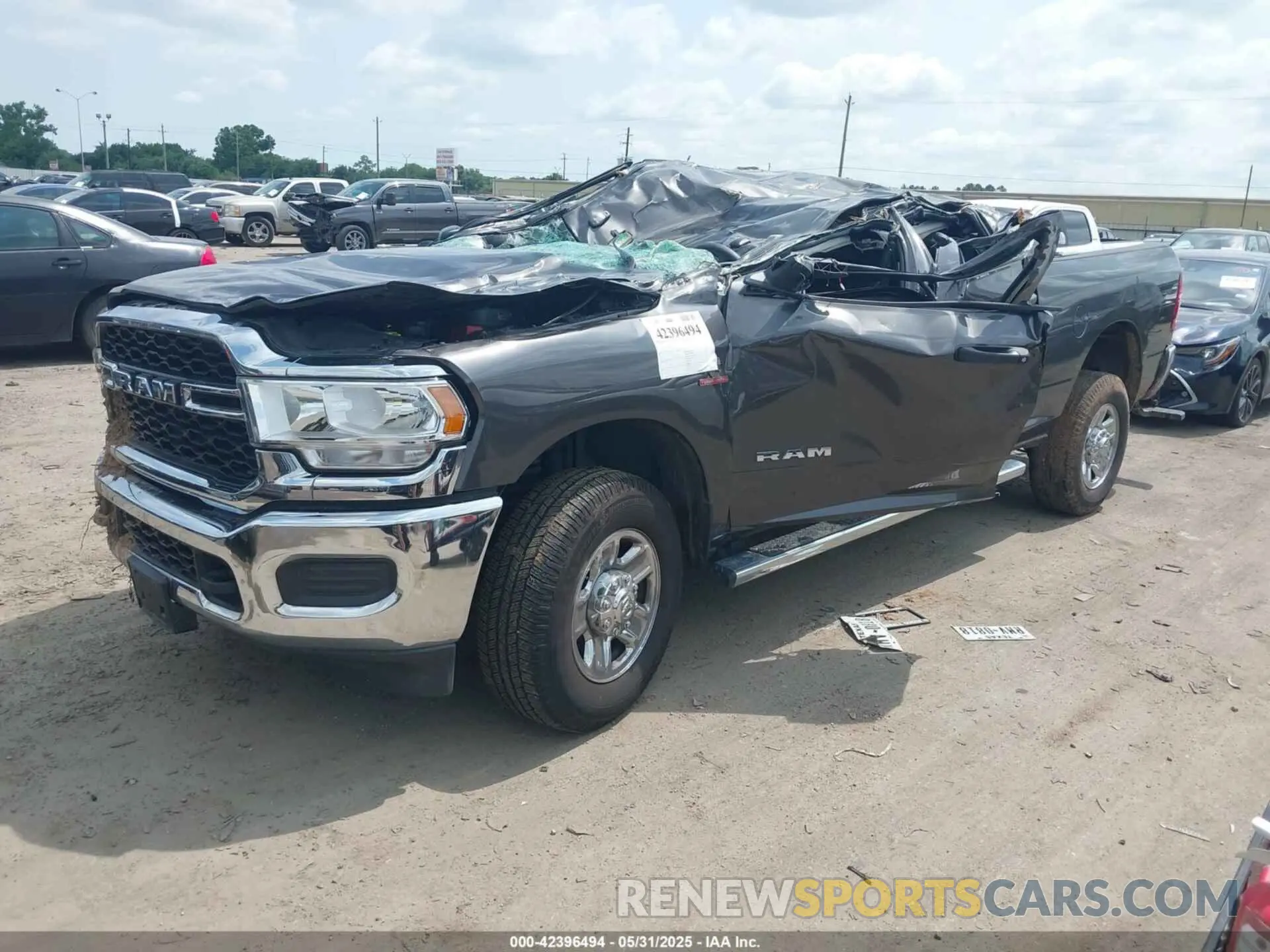 2 Photograph of a damaged car 3C6UR5CL7NG224127 RAM 2500 2022