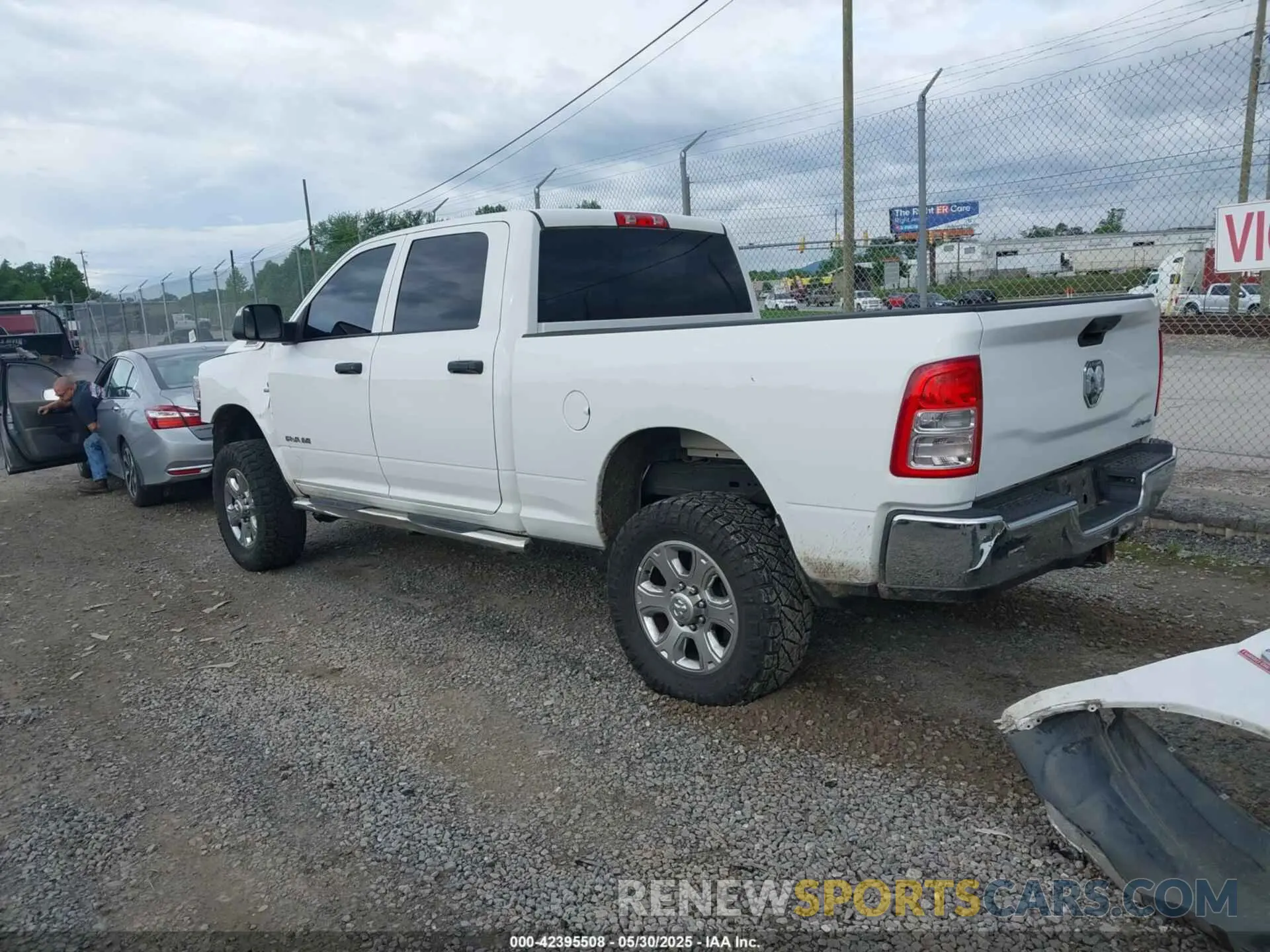 3 Photograph of a damaged car 3C6UR5CL9NG126846 RAM 2500 2022