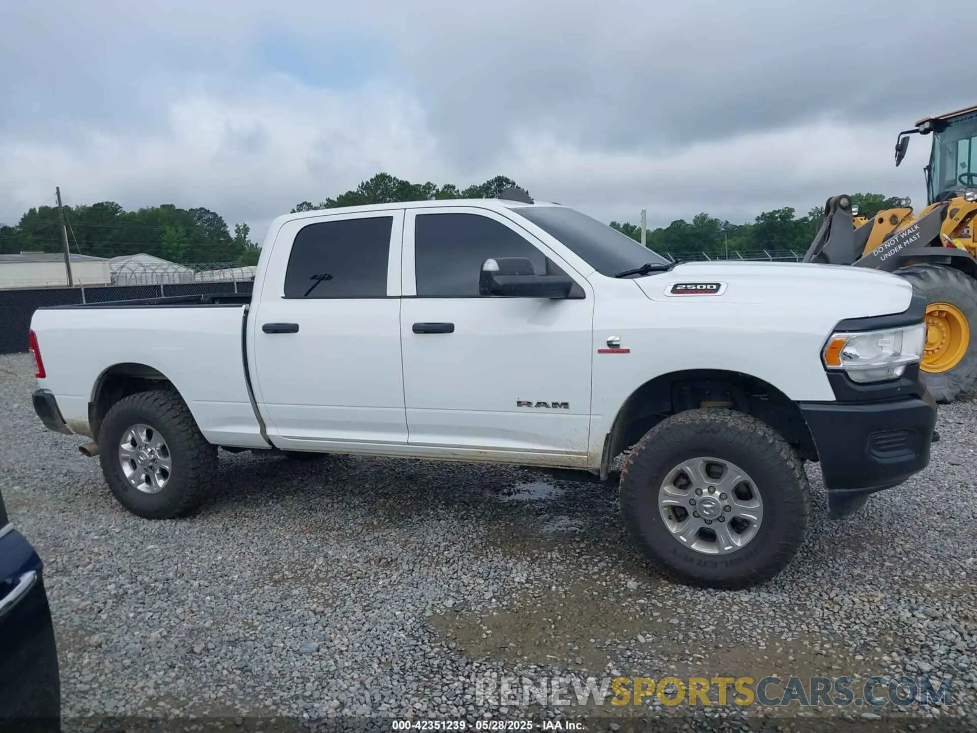 13 Photograph of a damaged car 3C6UR5CL9NG159894 RAM 2500 2022