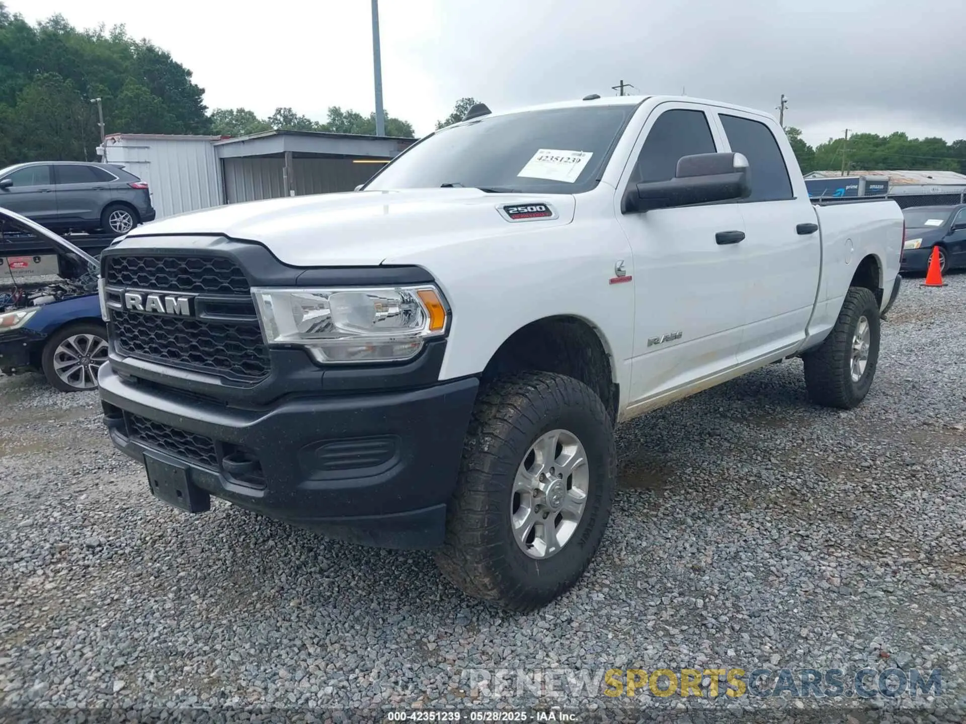 2 Photograph of a damaged car 3C6UR5CL9NG159894 RAM 2500 2022