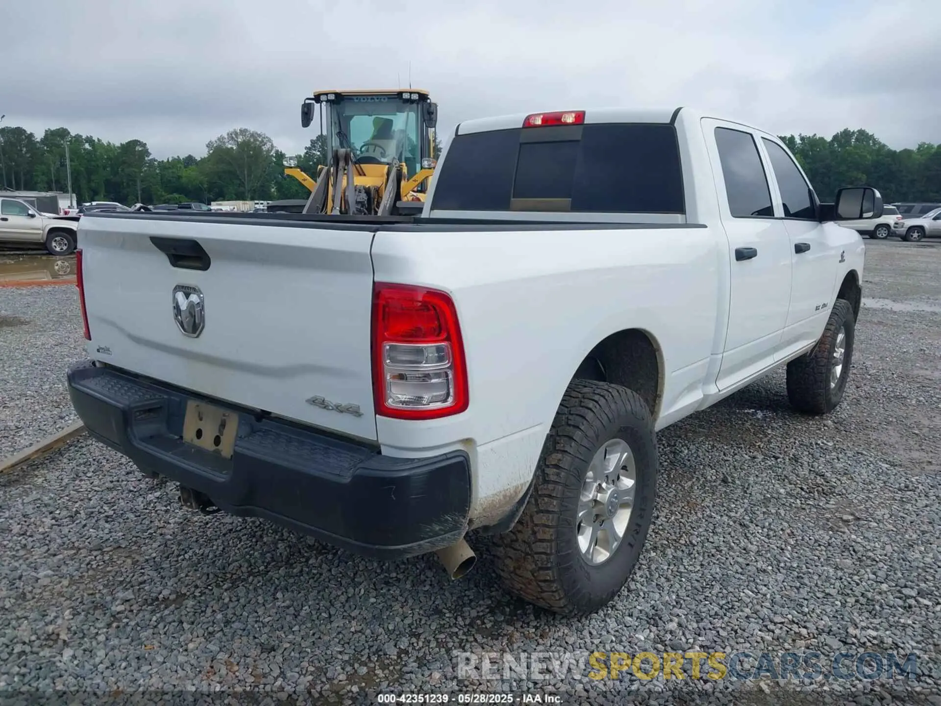 4 Photograph of a damaged car 3C6UR5CL9NG159894 RAM 2500 2022