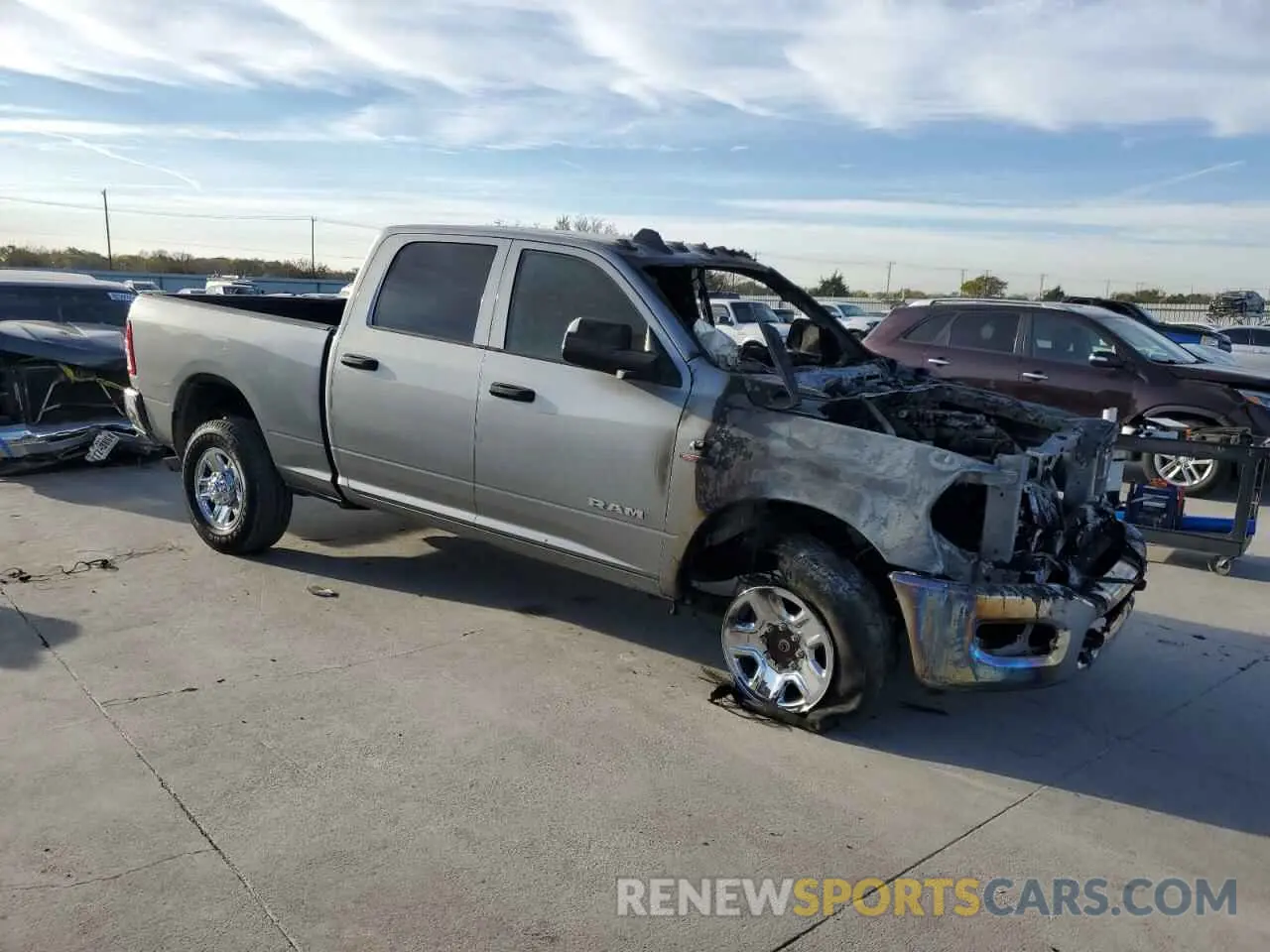 4 Photograph of a damaged car 3C6UR5CLXNG325212 RAM 2500 2022