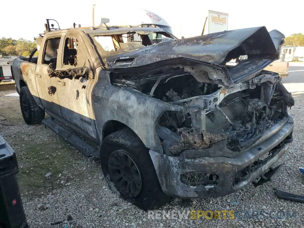 4 Photograph of a damaged car 3C6UR5DJ0NG397629 RAM 2500 2022