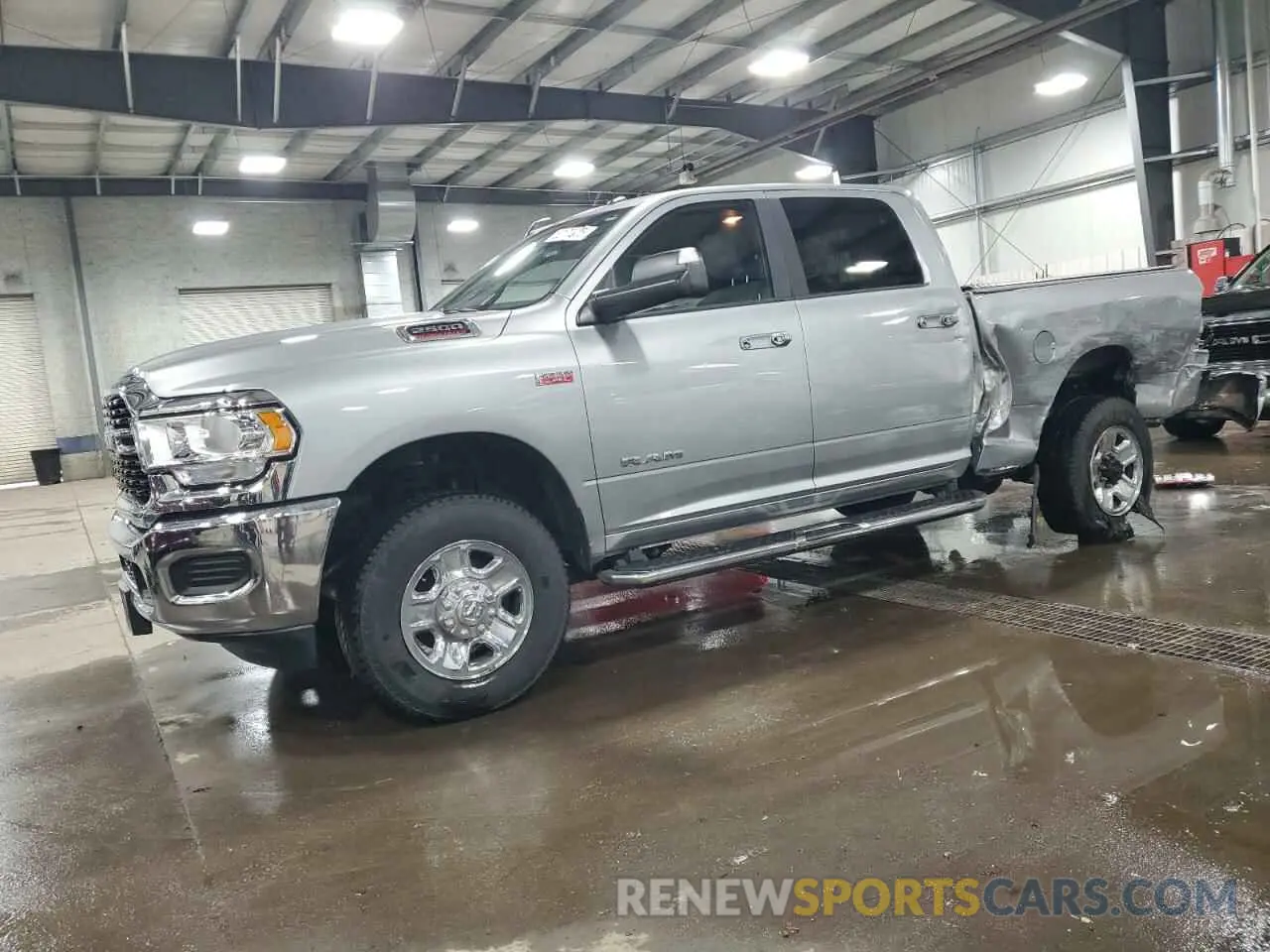 1 Photograph of a damaged car 3C6UR5DJXNG248029 RAM 2500 2022
