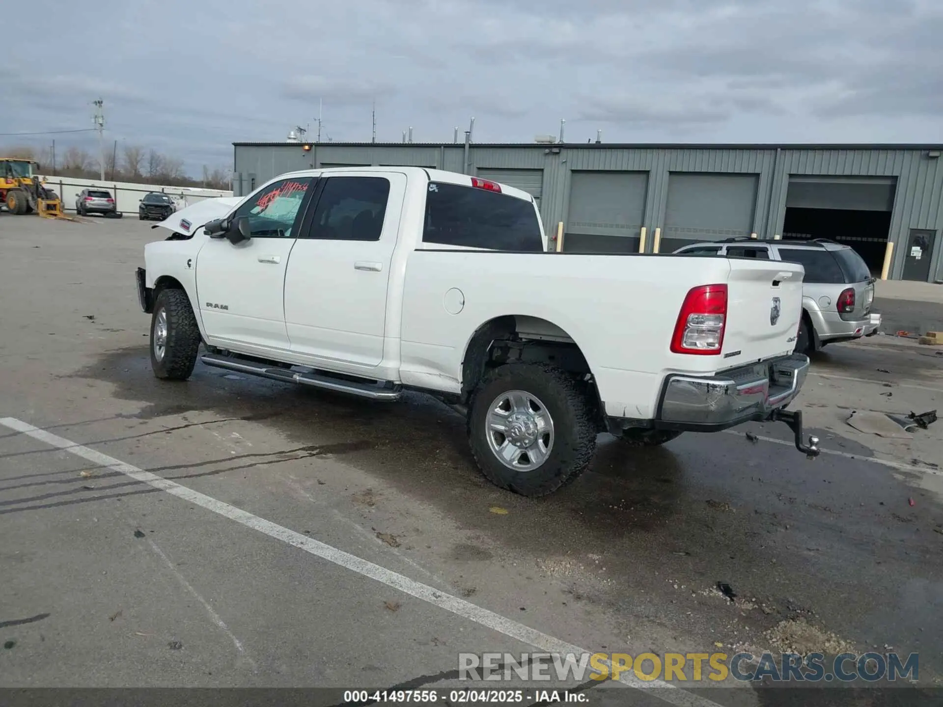 3 Photograph of a damaged car 3C6UR5DL0NG103812 RAM 2500 2022