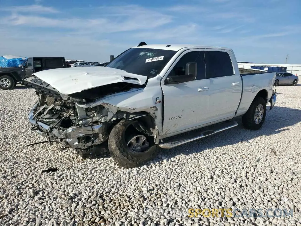 1 Photograph of a damaged car 3C6UR5DL0NG298052 RAM 2500 2022