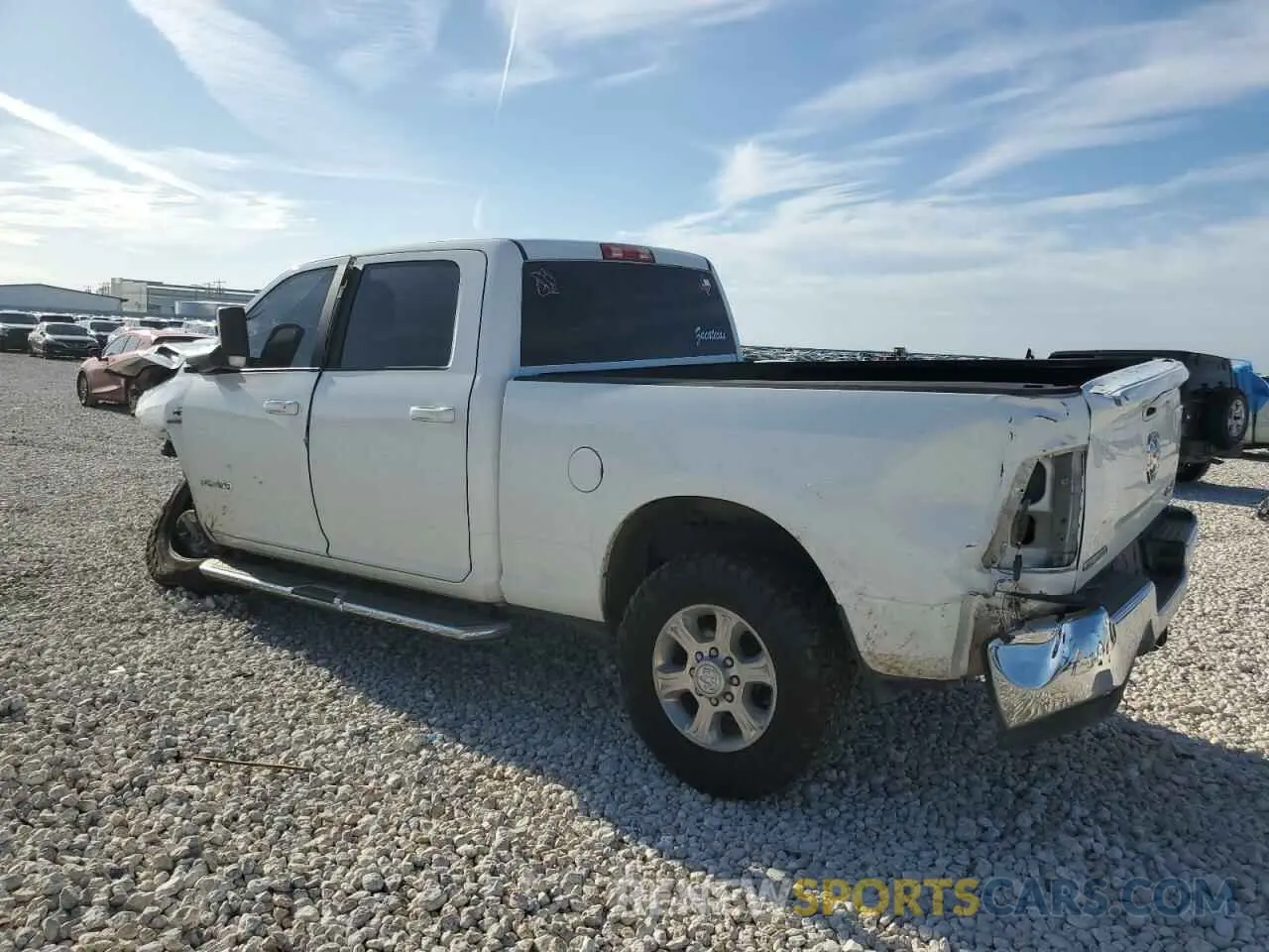2 Photograph of a damaged car 3C6UR5DL0NG298052 RAM 2500 2022